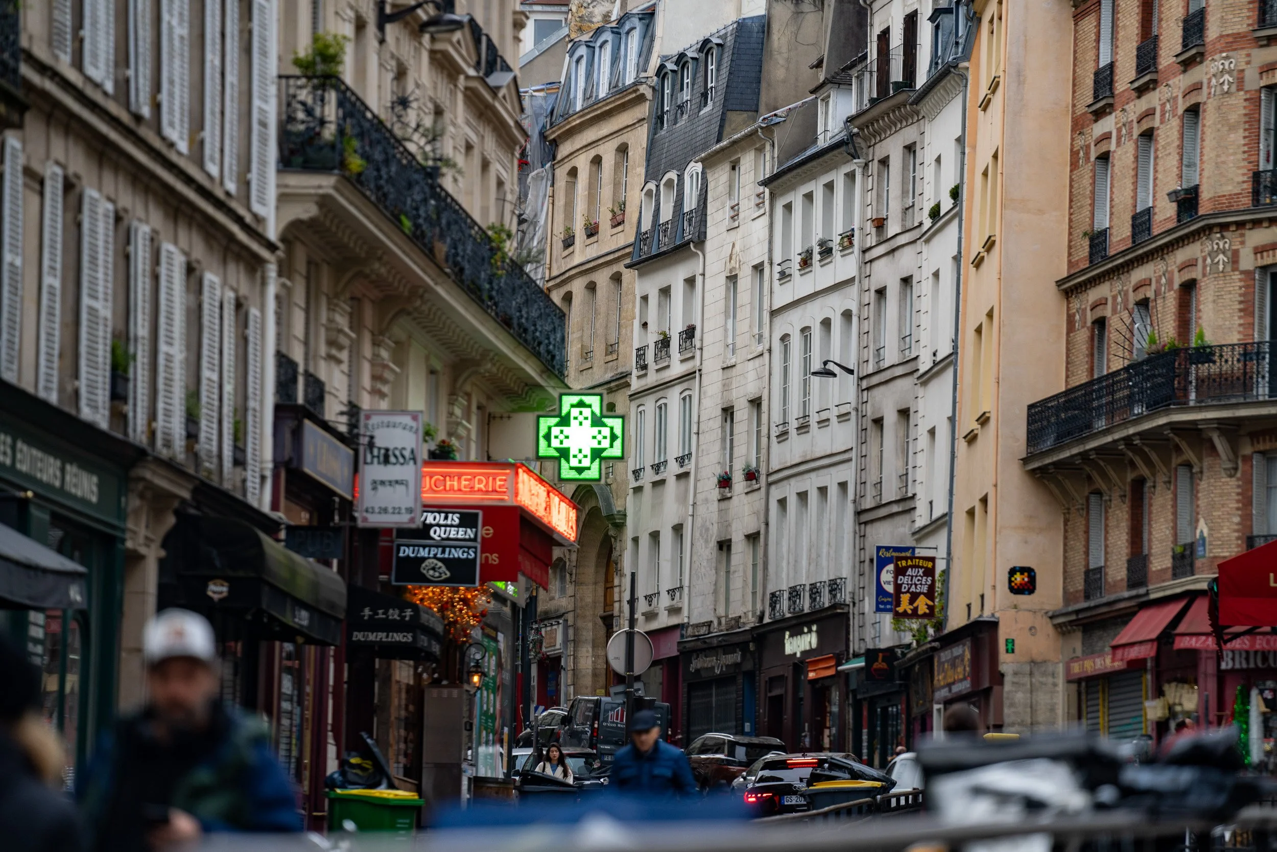 The welcoming green cross of a pharmacy.