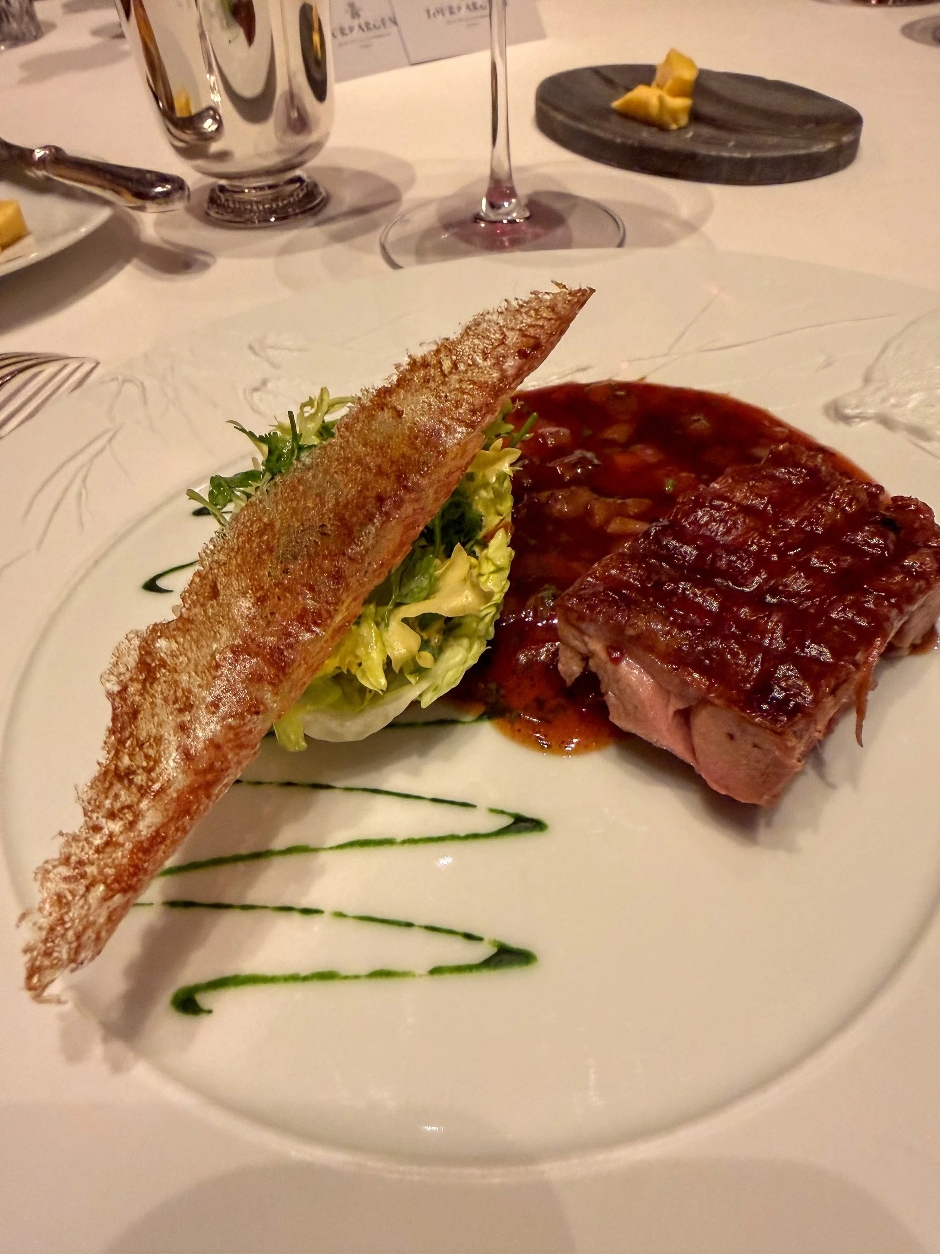 Serving course two of the duck, the leg.