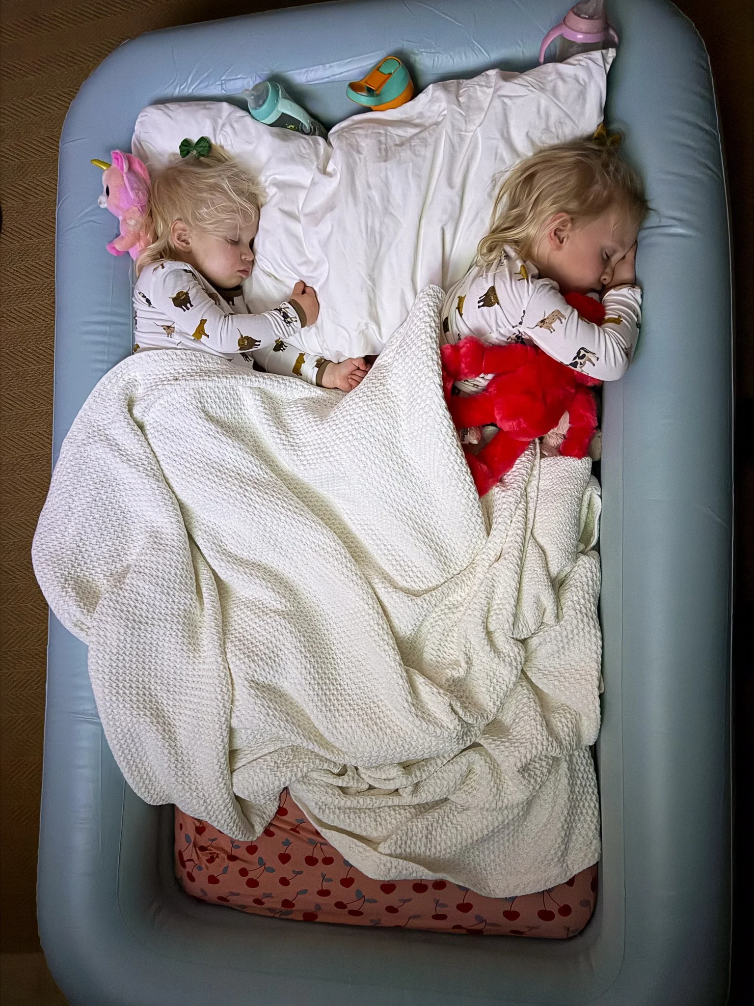 Sleeping girls in swimming pool airbed