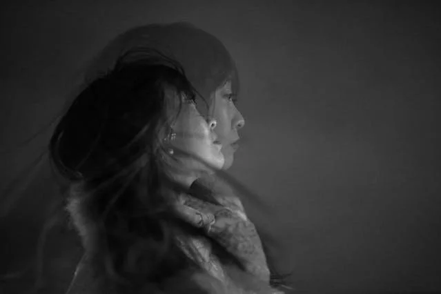 Double exposure of woman symbolizing inner conflict and perfectionism as a trauma response.