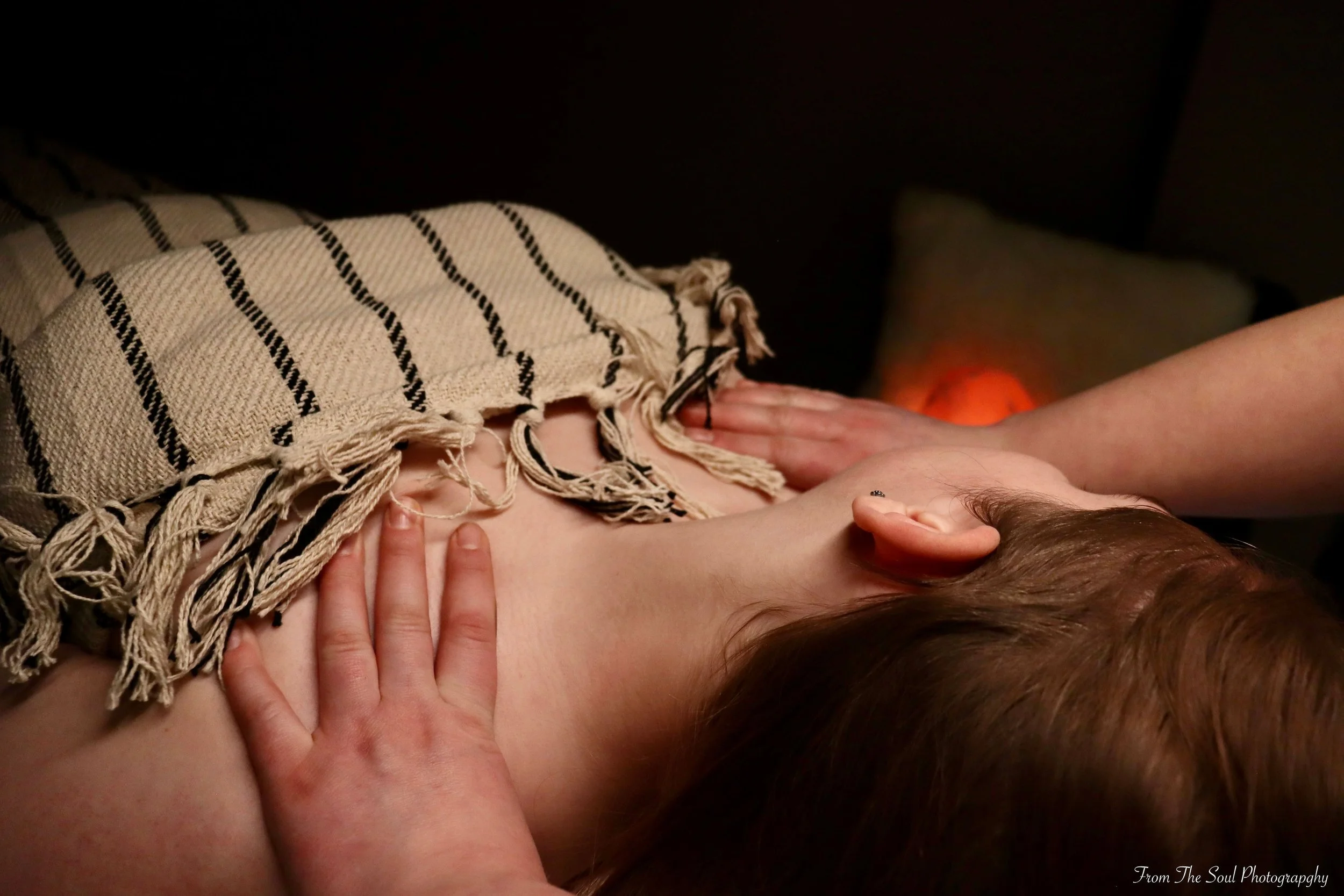 Woman relaxing on her back enjoying a Swedish Massage