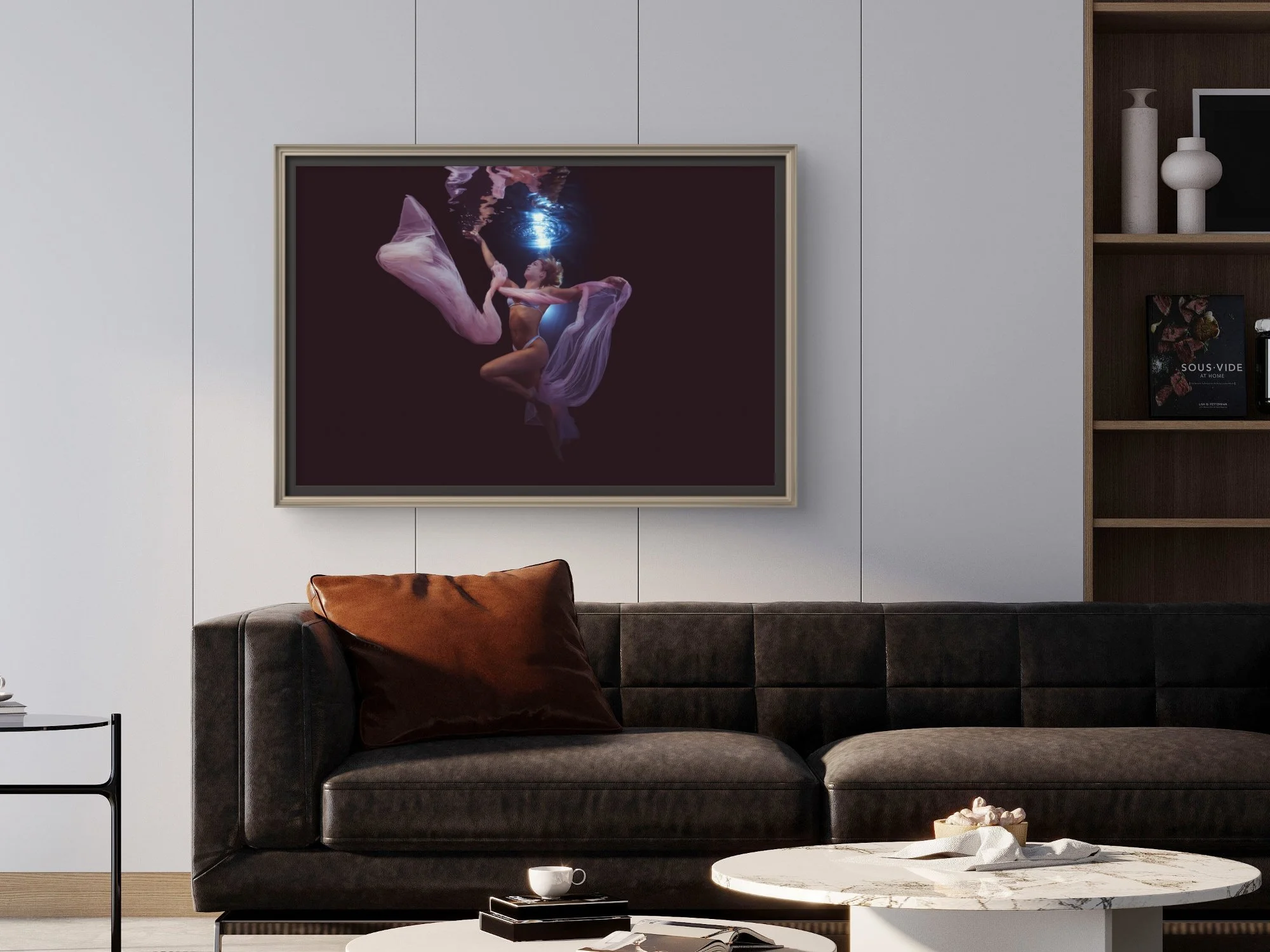 Woman in a white swimsuit posing underwater in a pool, with reflection visible on the surface.