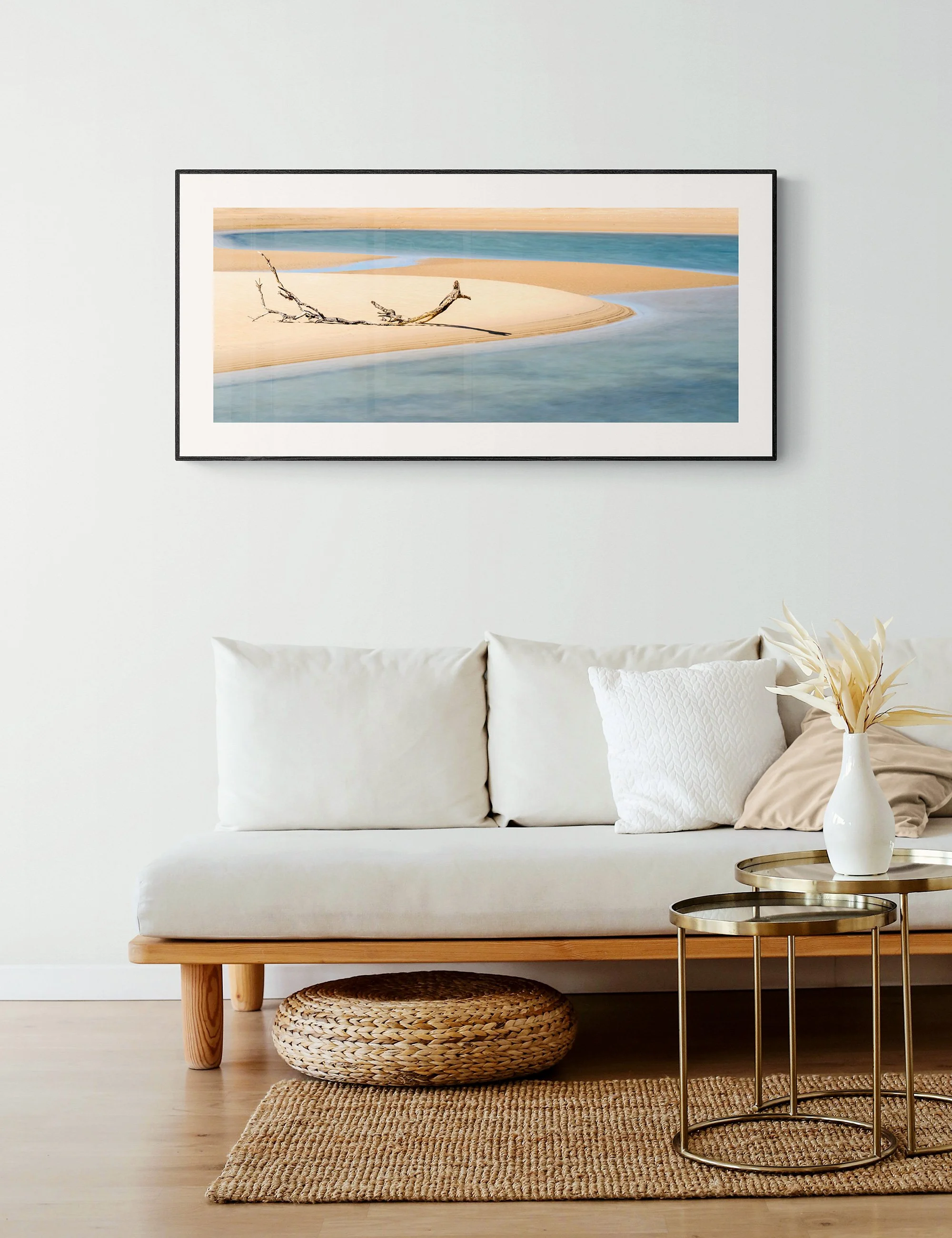 "Tide's Artistry" from the Secluded Shorelines series by Ian J. Muirhead Arts, displayed as a framed minimalist seascape print in a natural contemporary interior.