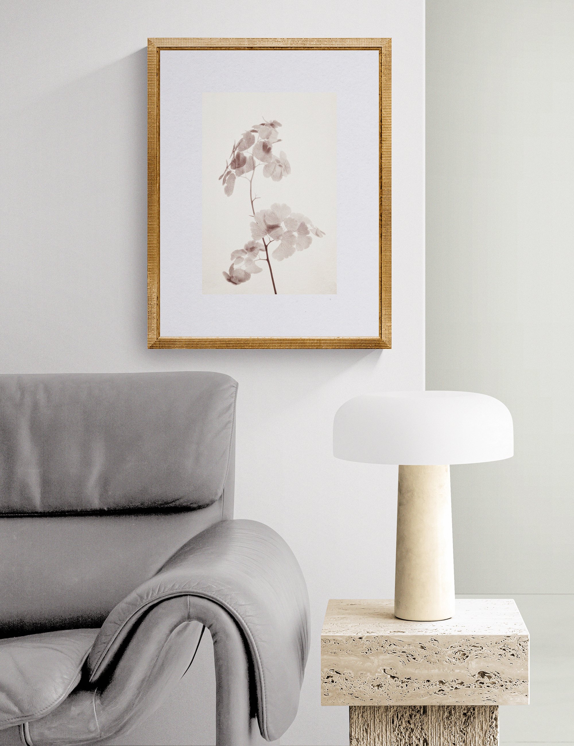 Fronded Forms limited edition botanical photograph by Ian J. Muirhead Arts, displayed in a contemporary reading corner with a sculptural lounge chair, stone side table and soft neutral tones.