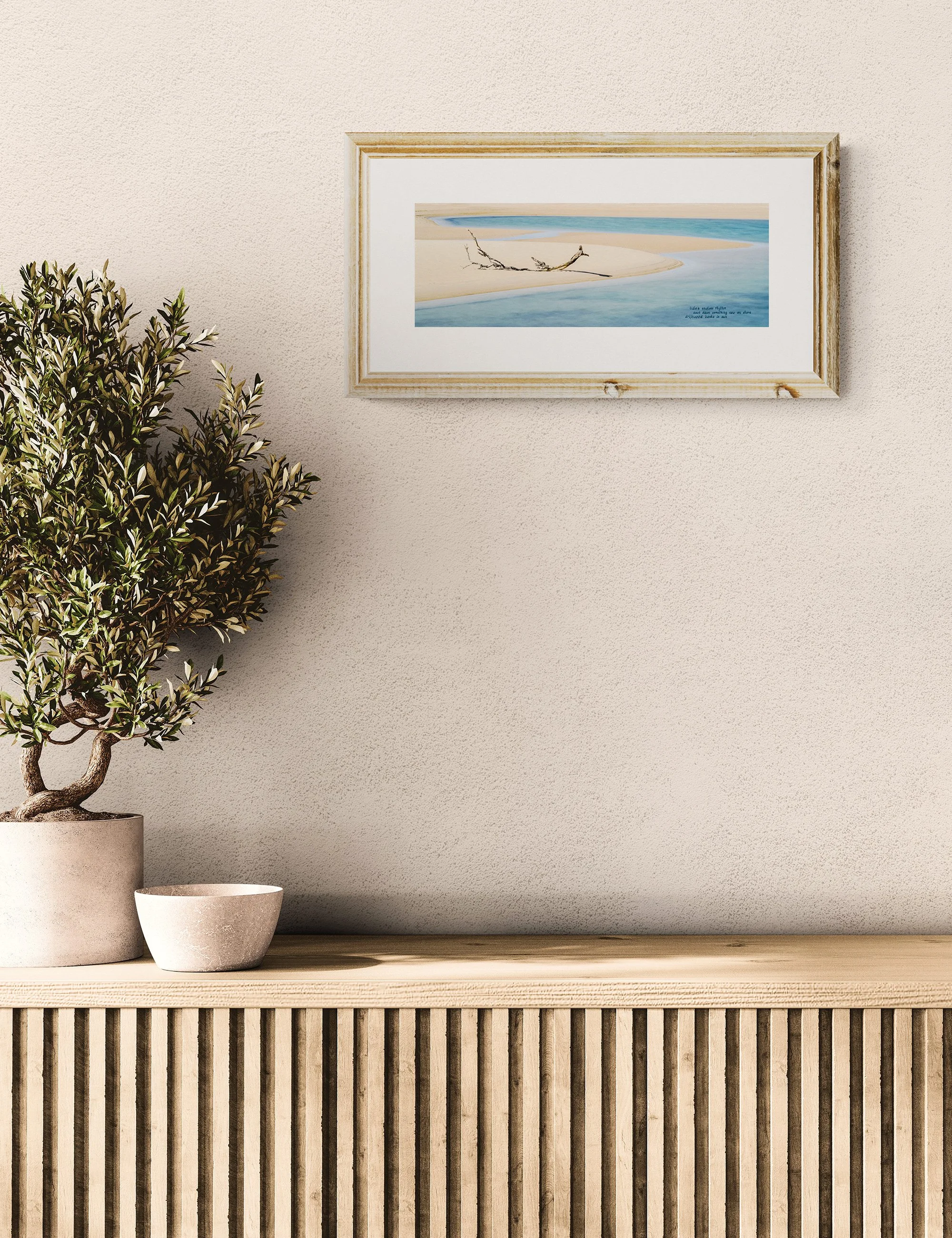 “DRIFTWOOD” haiga print by Ian J. Muirhead Arts, featuring minimalist coastal photography with embedded haiku and soft blue shoreline tones.