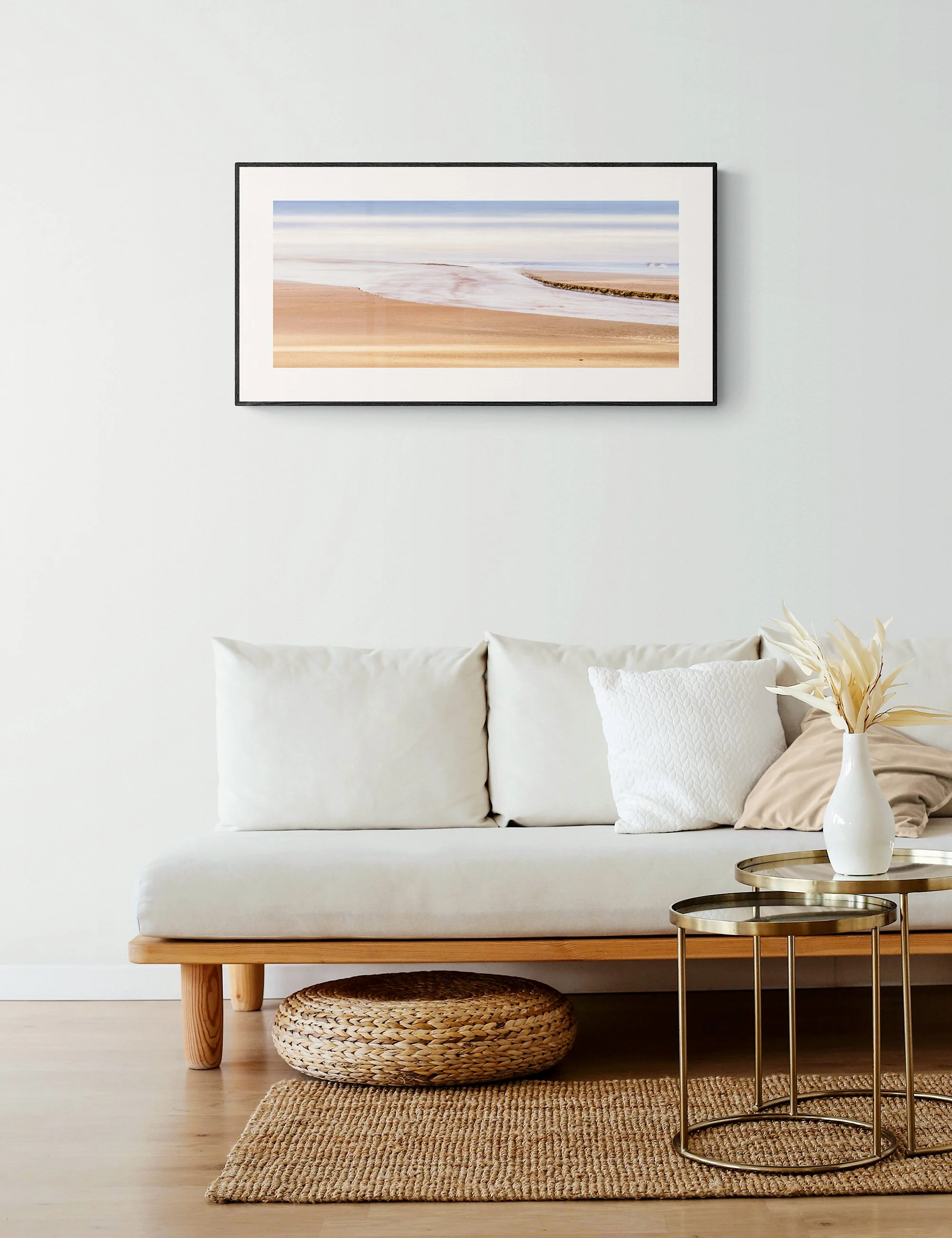 "Where the Stream Rests" from the Secluded Shorelines series by Ian J. Muirhead Arts, displayed as a framed minimalist seascape print in a natural contemporary interior.