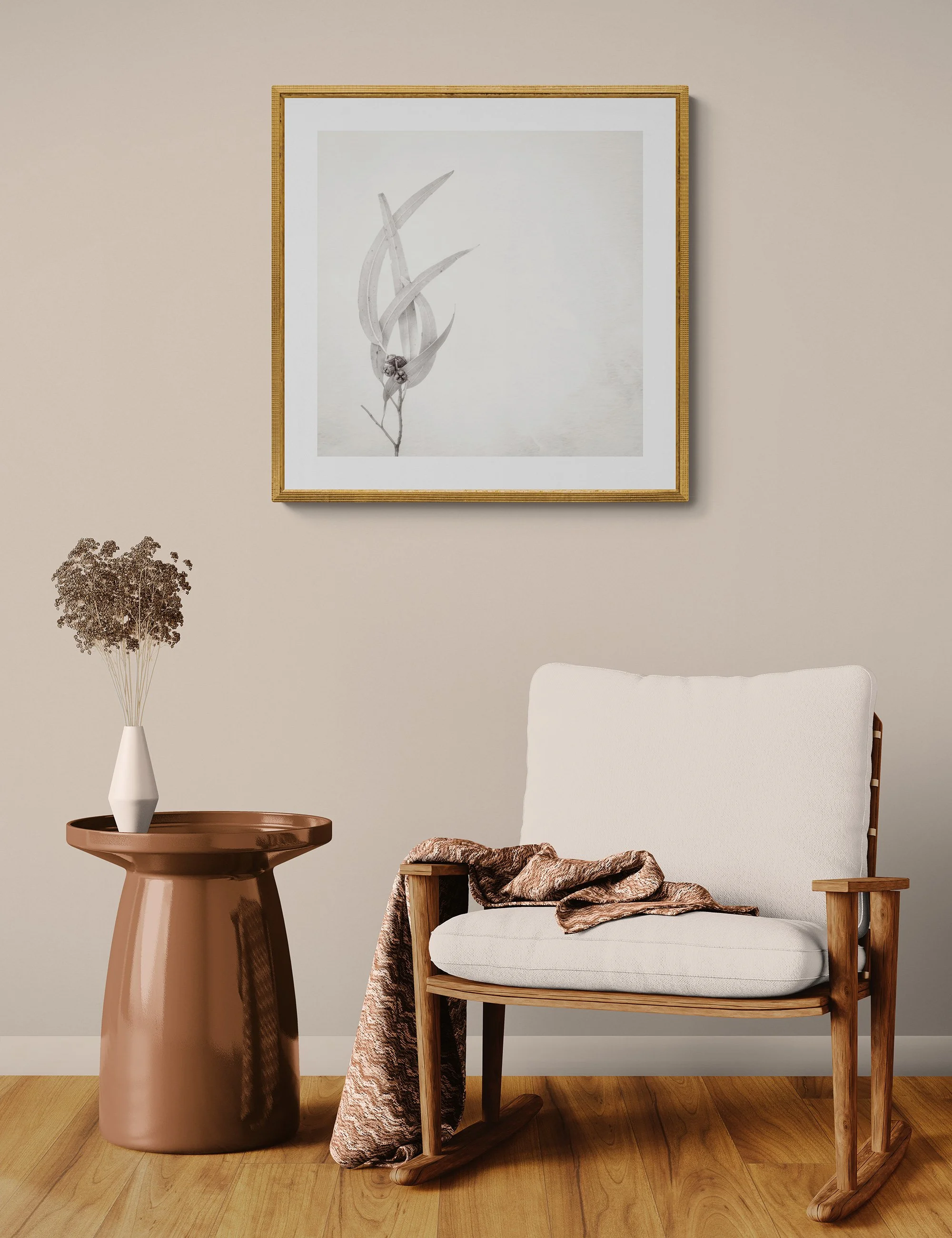 "Entwined" by Ian J Muirhead displayed as a framed botanical fine art print in a warm neutral contemporary interior with timber chair and side table.