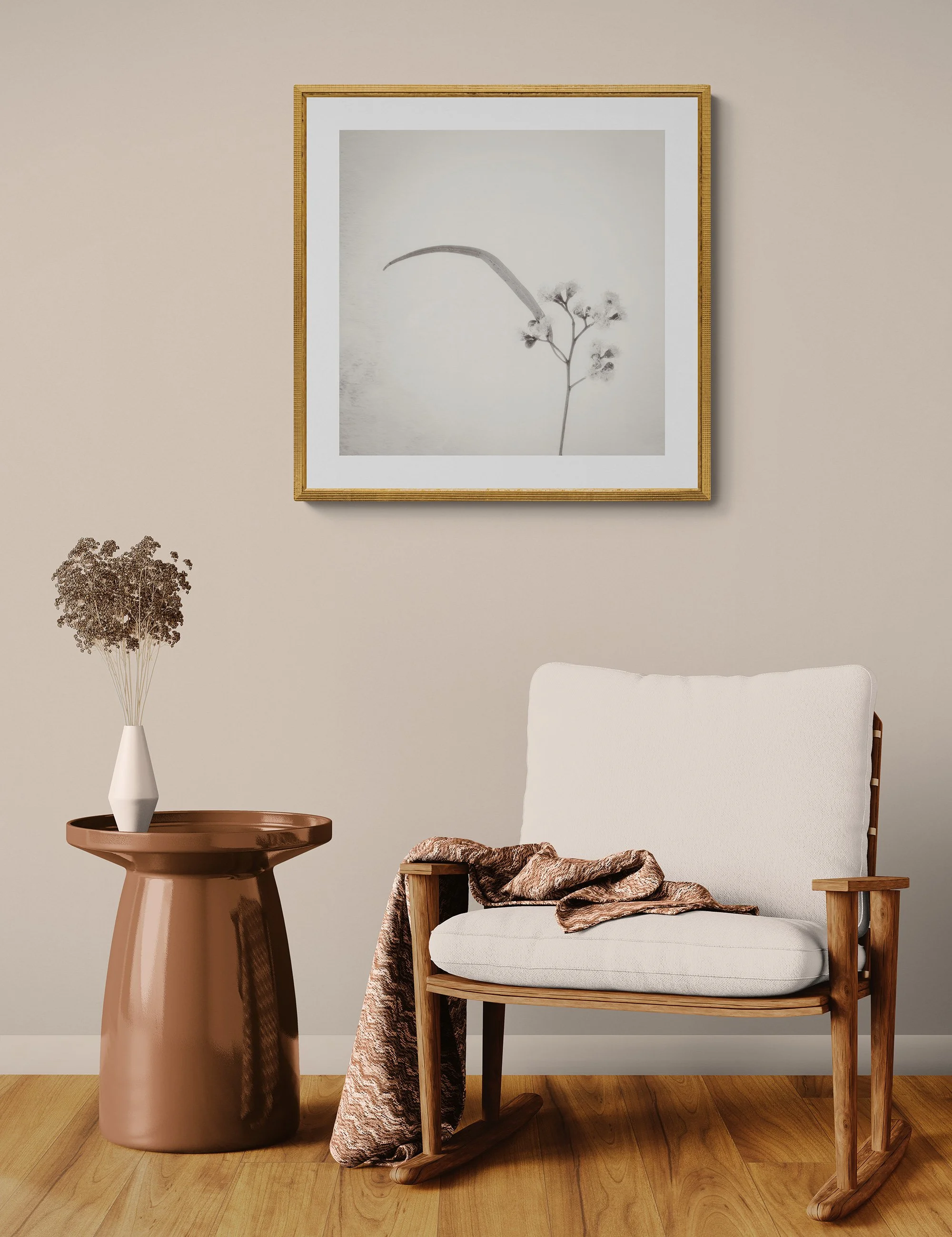 "Silent Reach" by Ian J Muirhead displayed as a framed botanical fine art print in a warm neutral contemporary interior with timber chair and side table.