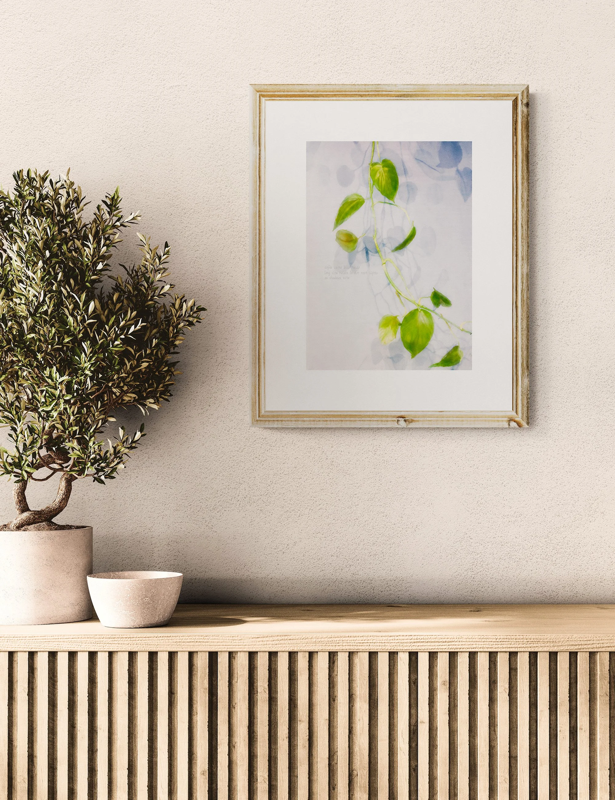 “ECHOING SHADOWS” haiga print by Ian J. Muirhead Arts, featuring trailing green foliage in soft abstract light with embedded haiku text.