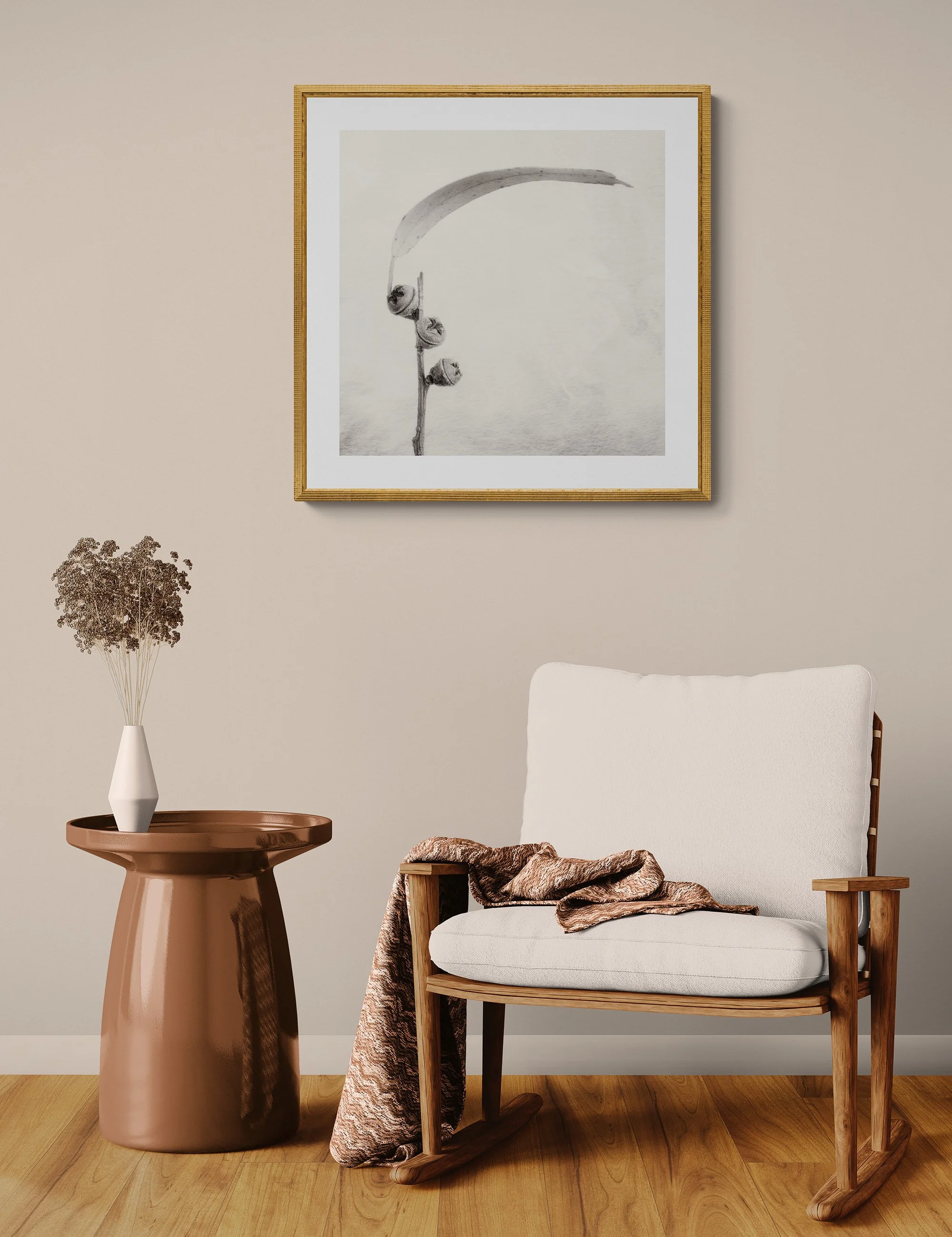 "Arc of Time" by Ian J Muirhead displayed as a framed botanical fine art print in a warm neutral contemporary interior with timber chair and side table.