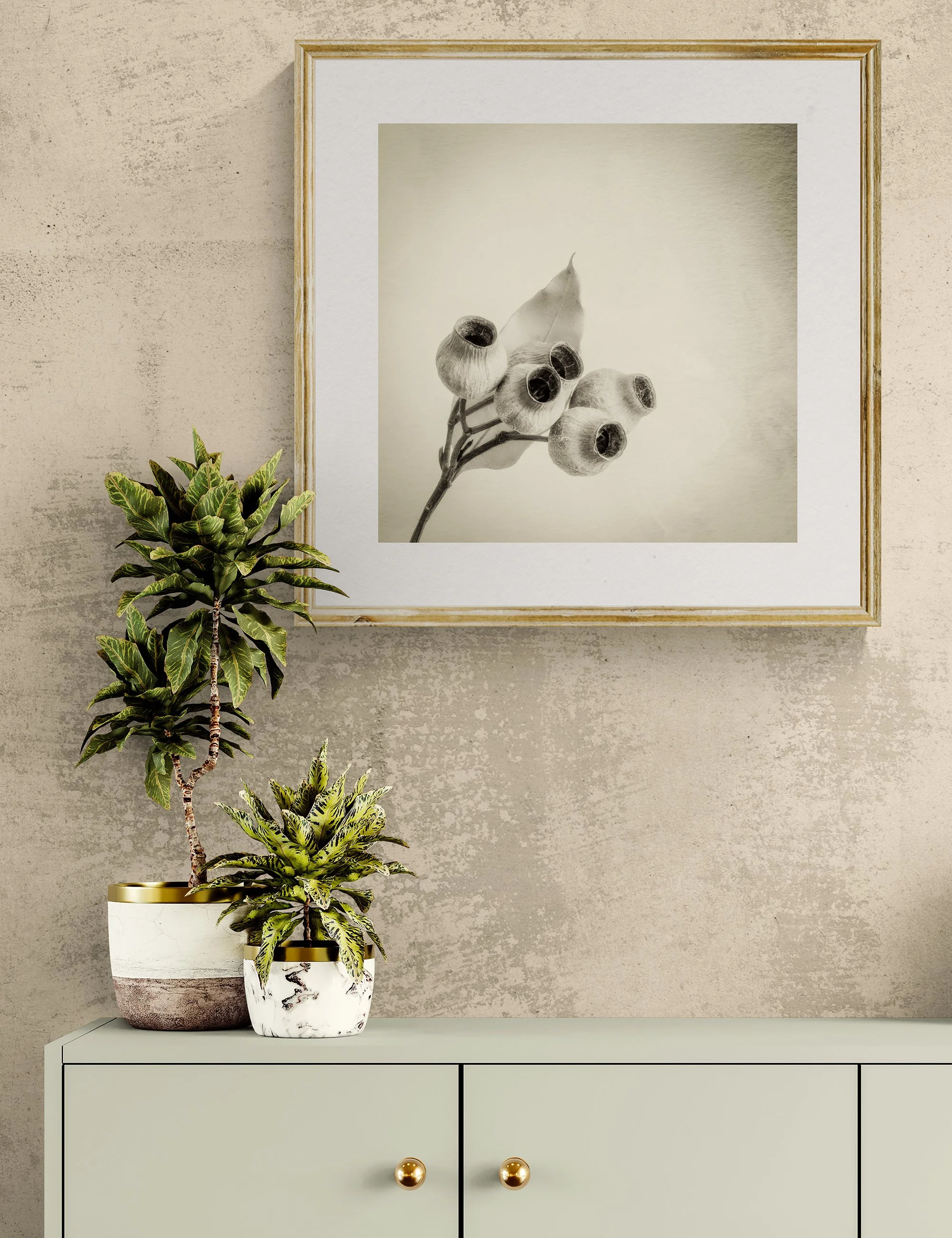 "Togetherness" from the Gumnut Gestures series by Ian J. Muirhead Arts, displayed in a contemporary interior above a minimalist cabinet with botanical styling and a light timber frame.