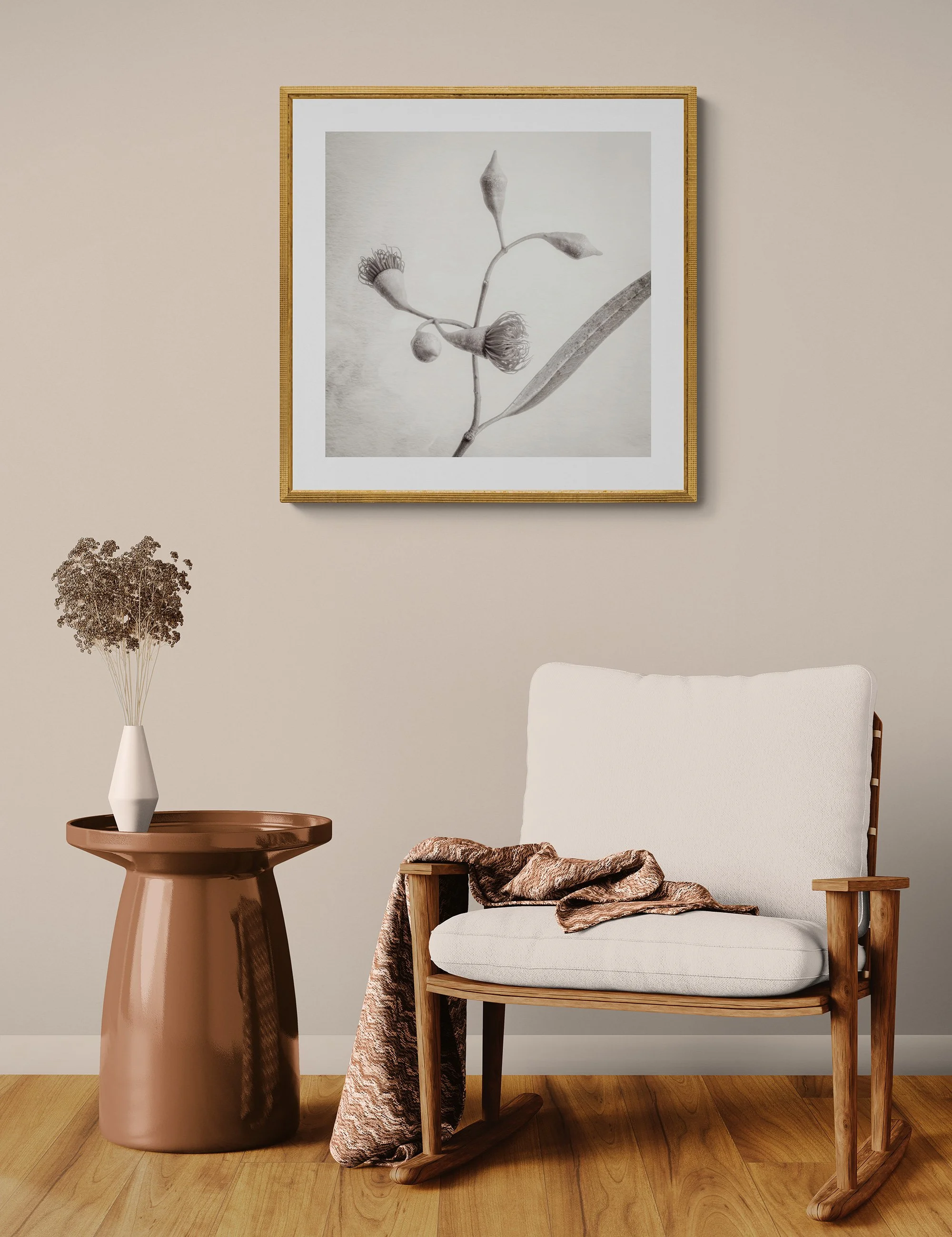 "Floral Twirl" by Ian J Muirhead displayed as a framed botanical fine art print in a warm neutral contemporary interior with timber chair and side table.
