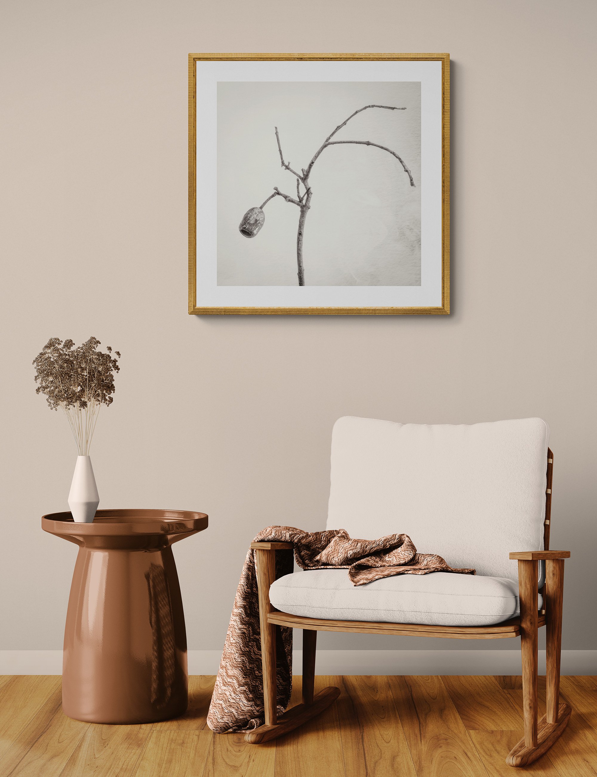 "Solitude" by Ian J Muirhead displayed as a framed botanical fine art print in a warm neutral contemporary interior with timber chair and side table.
