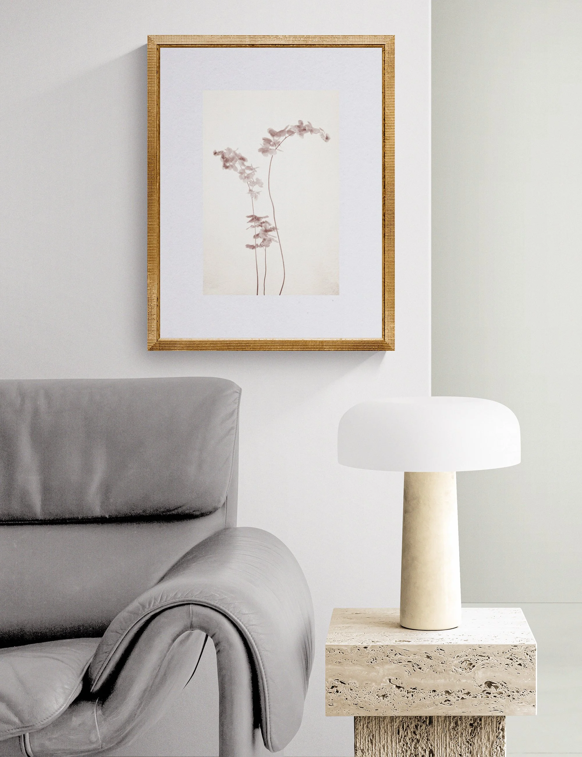 Fronded Forms limited edition botanical photograph by Ian J. Muirhead Arts, displayed in a contemporary reading corner with a sculptural lounge chair, stone side table and soft neutral tones.