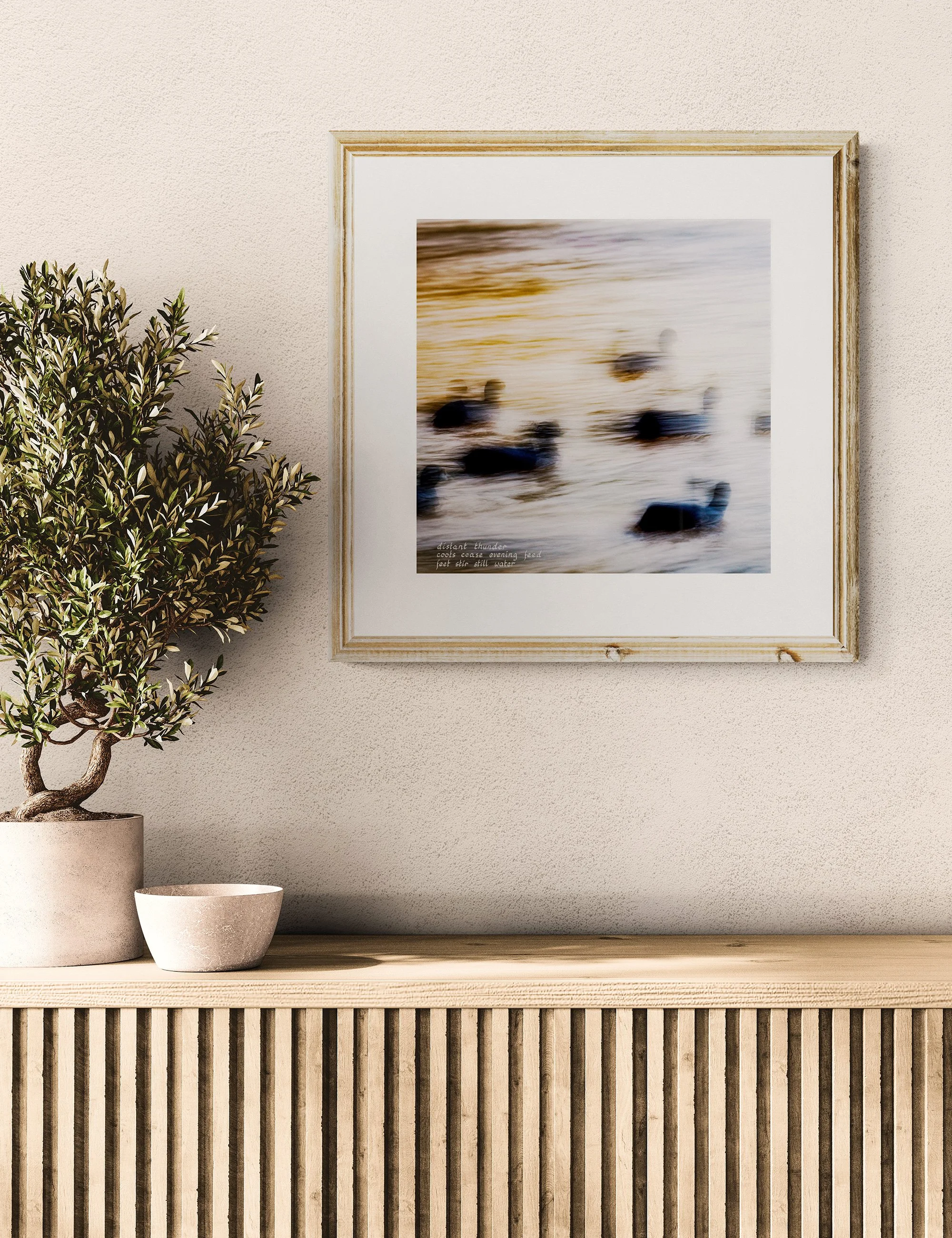 “FOREBODING” haiga print by Ian J. Muirhead Arts, featuring blurred waterbirds in soft motion with embedded haiku and atmospheric coastal tones.