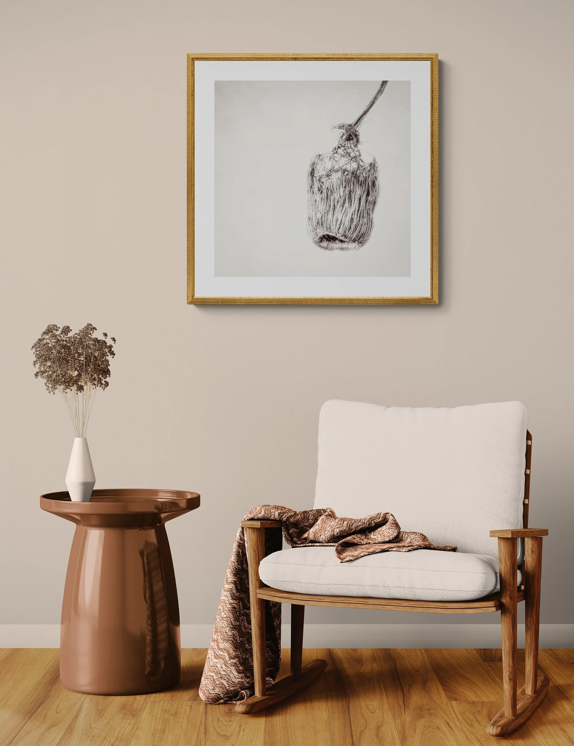 "Threadbare Remnant" by Ian J Muirhead displayed as a framed botanical fine art print in a warm neutral contemporary interior with timber chair and side table.