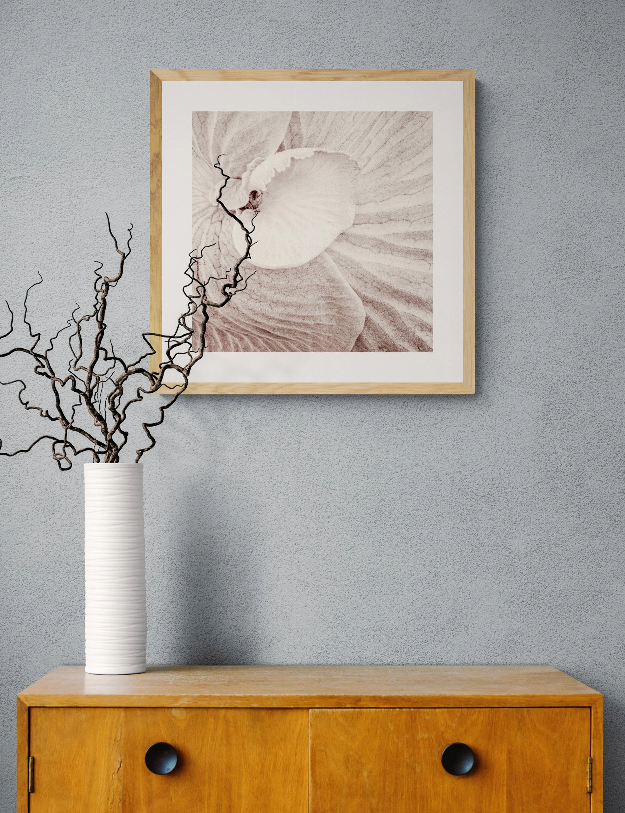 “The Staghorn's Heart” from the Fronded Forms fern series by Ian J. Muirhead Arts, displayed in a minimalist interior with a light timber frame and sculptural branches.