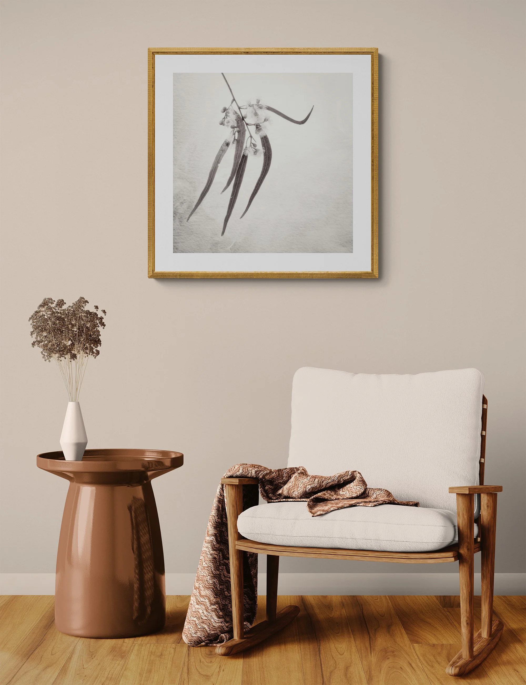 "Botanical Ballet" by Ian J Muirhead displayed as a framed botanical fine art print in a warm neutral contemporary interior with timber chair and side table.