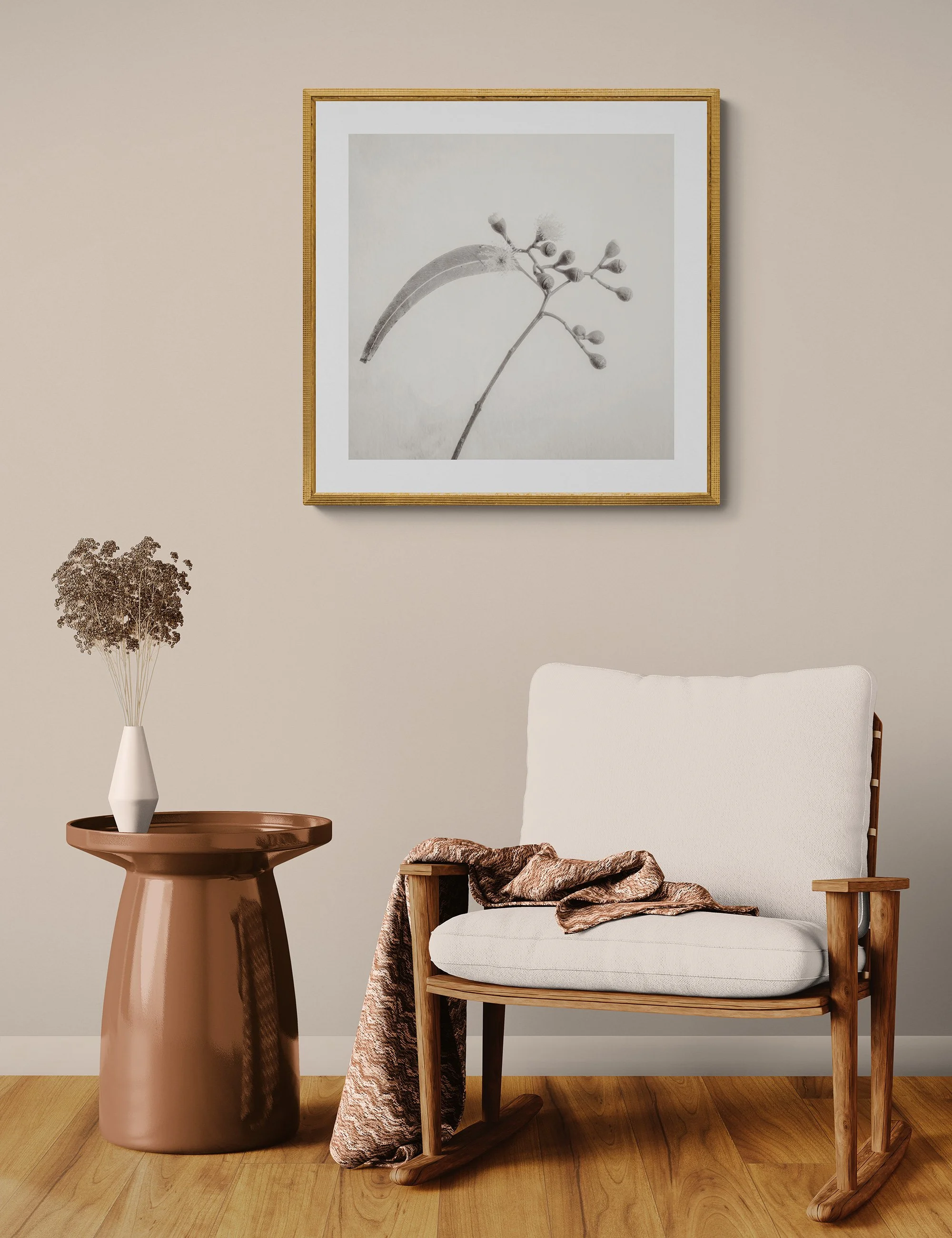 "Awakening Buds" by Ian J Muirhead displayed as a framed botanical fine art print in a warm neutral contemporary interior with timber chair and side table.