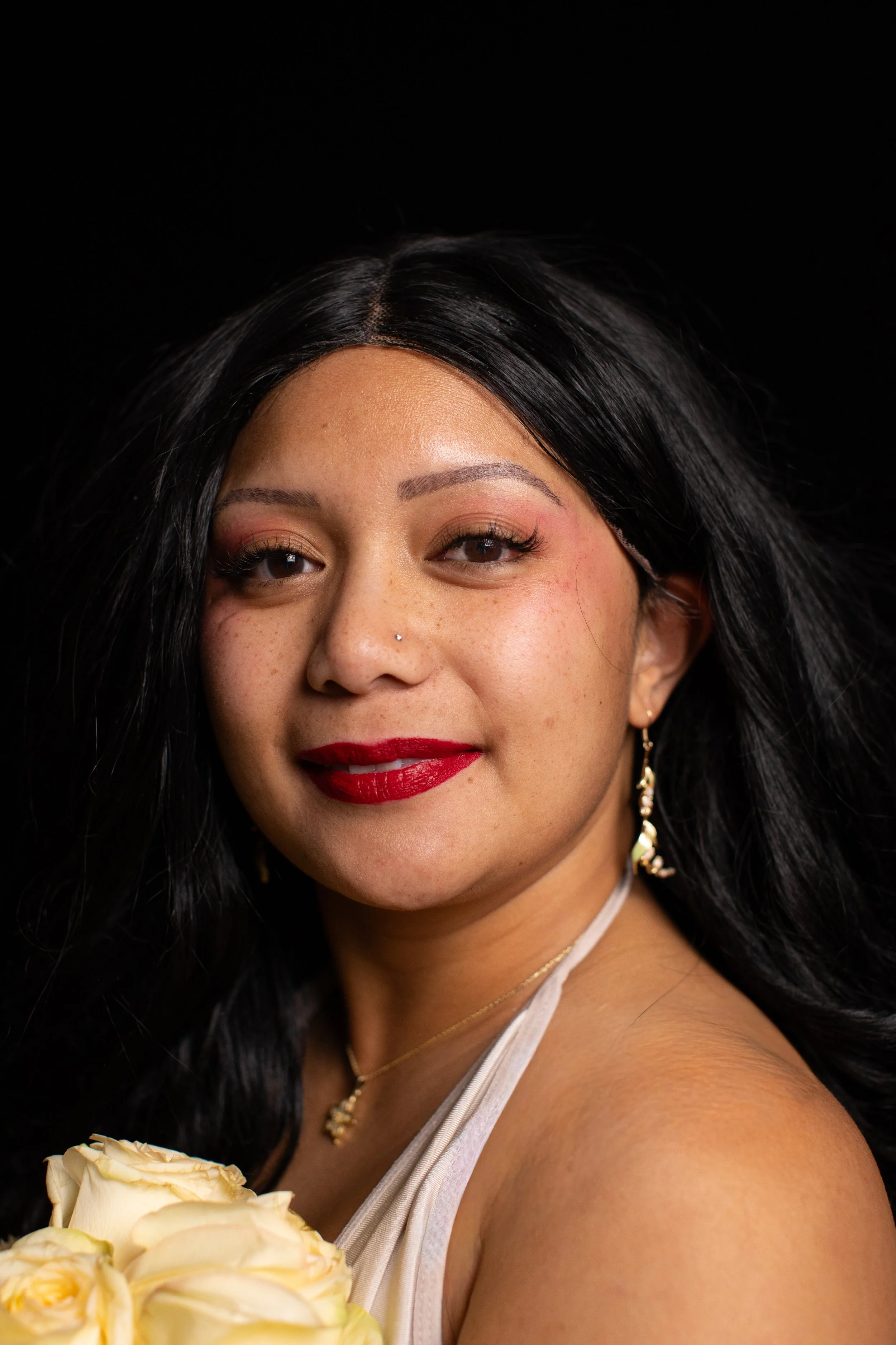 A Phillipina woman in her 30s posing for head shots