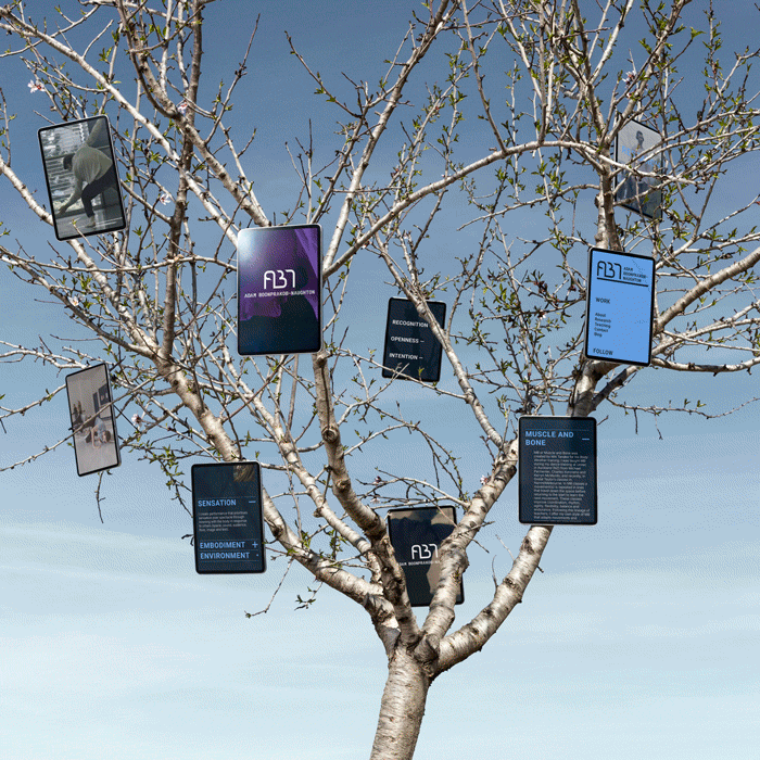 A leafless tree with various digital screens hanging from its branches displaying text and graphics, against a blue sky background.