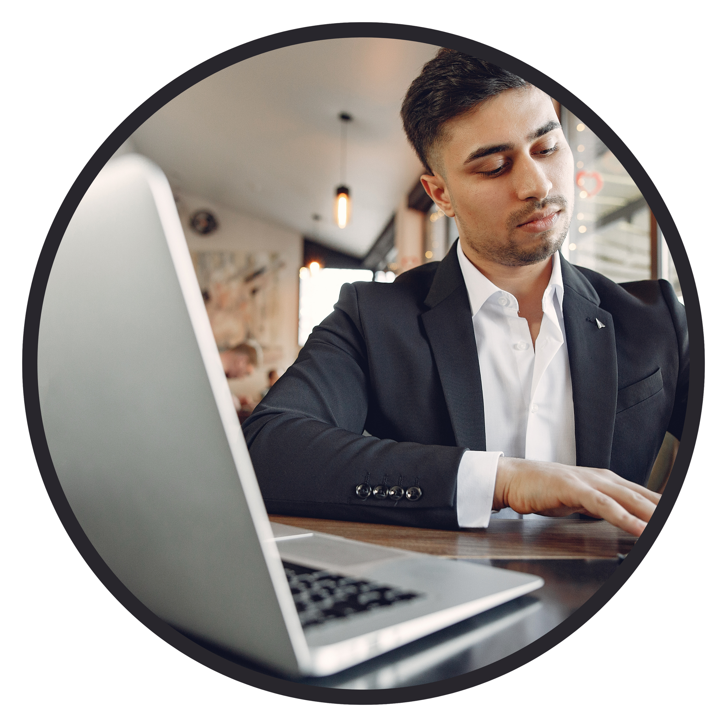 Circular image of a man in a suit working on a laptop