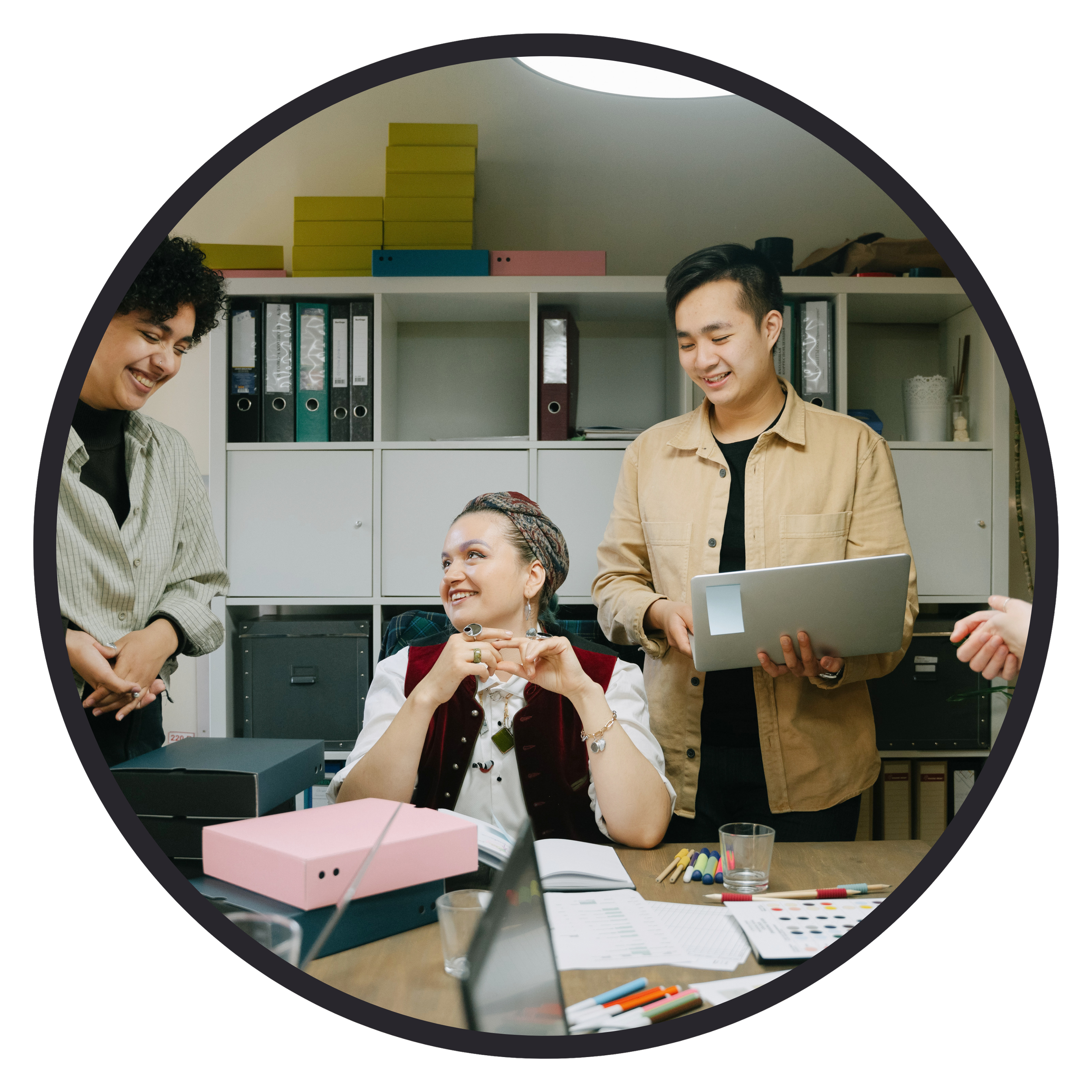 Circular image of people working together in the office