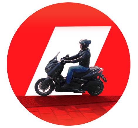 Person riding a black scooter, wearing a black helmet and black jacket, with a red and white abstract background.