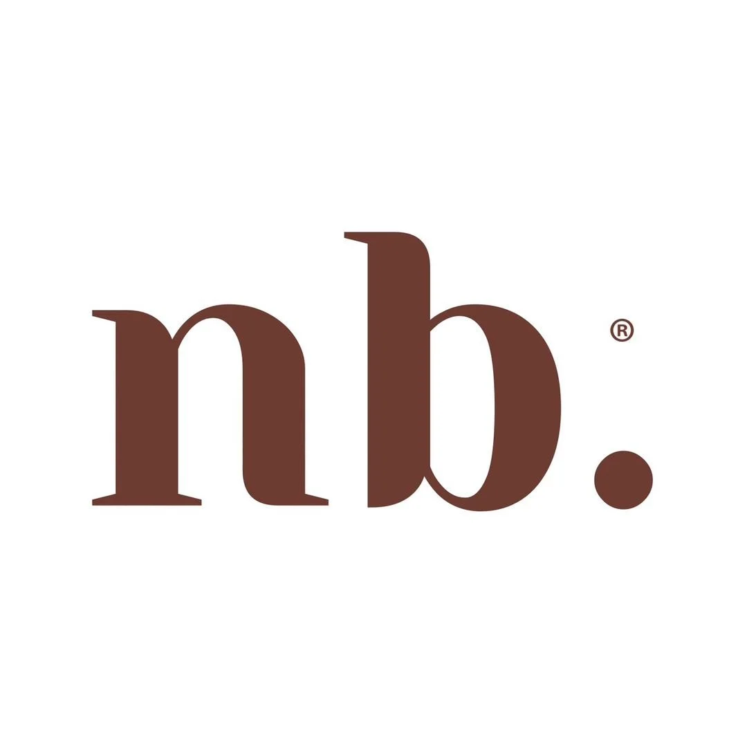 Logo with lowercase brown letters 'n' and 'b' separated by a dot, on a white background.