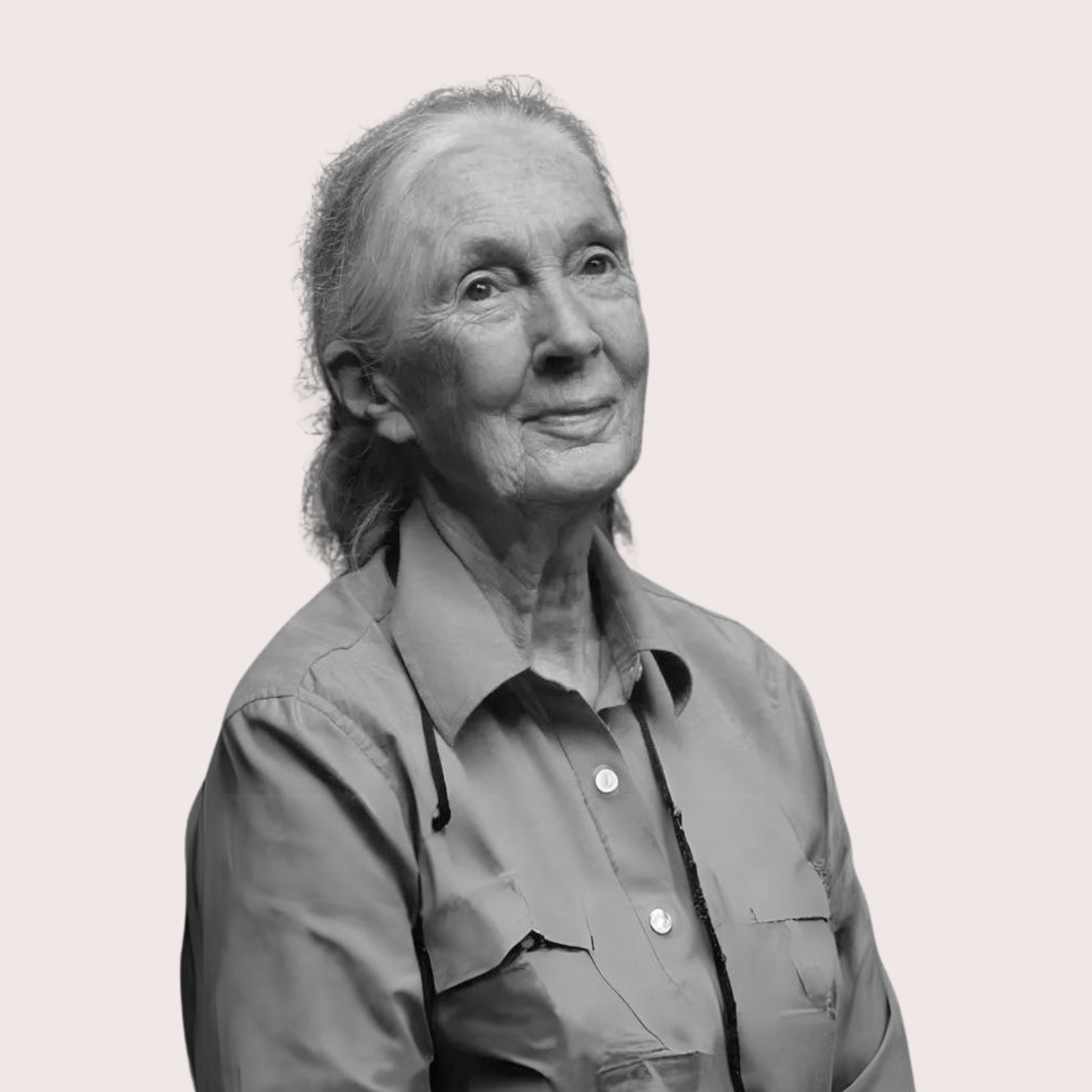 Black and white portrait of an elderly woman with long hair, wearing a collared shirt and glasses hanging from her neck. Best confidence self esteem training program for women