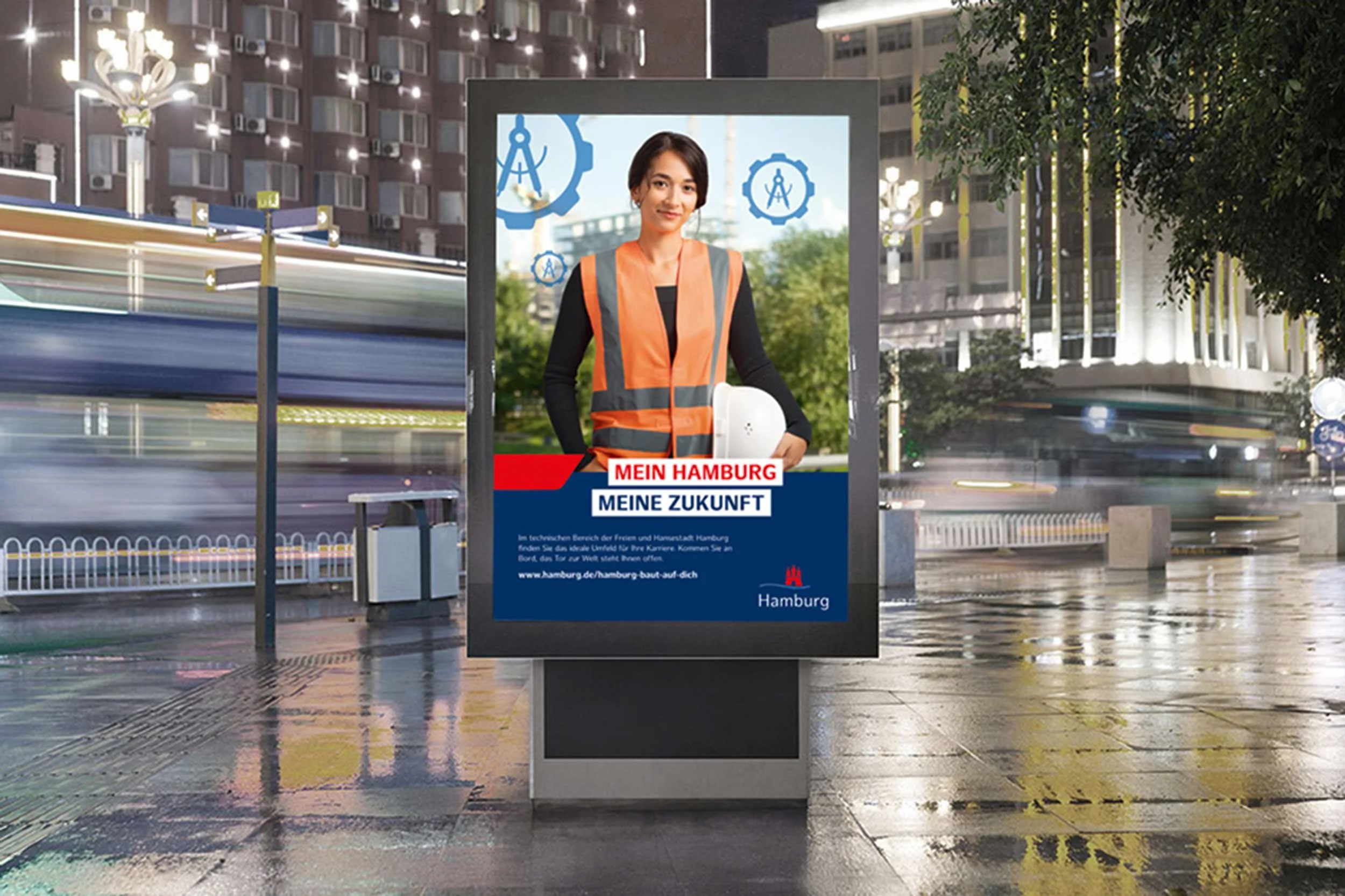 Außenwerbung der Stadt Hamburg mit technischer Fachkraft auf digitalem Werbedisplay bei Nacht