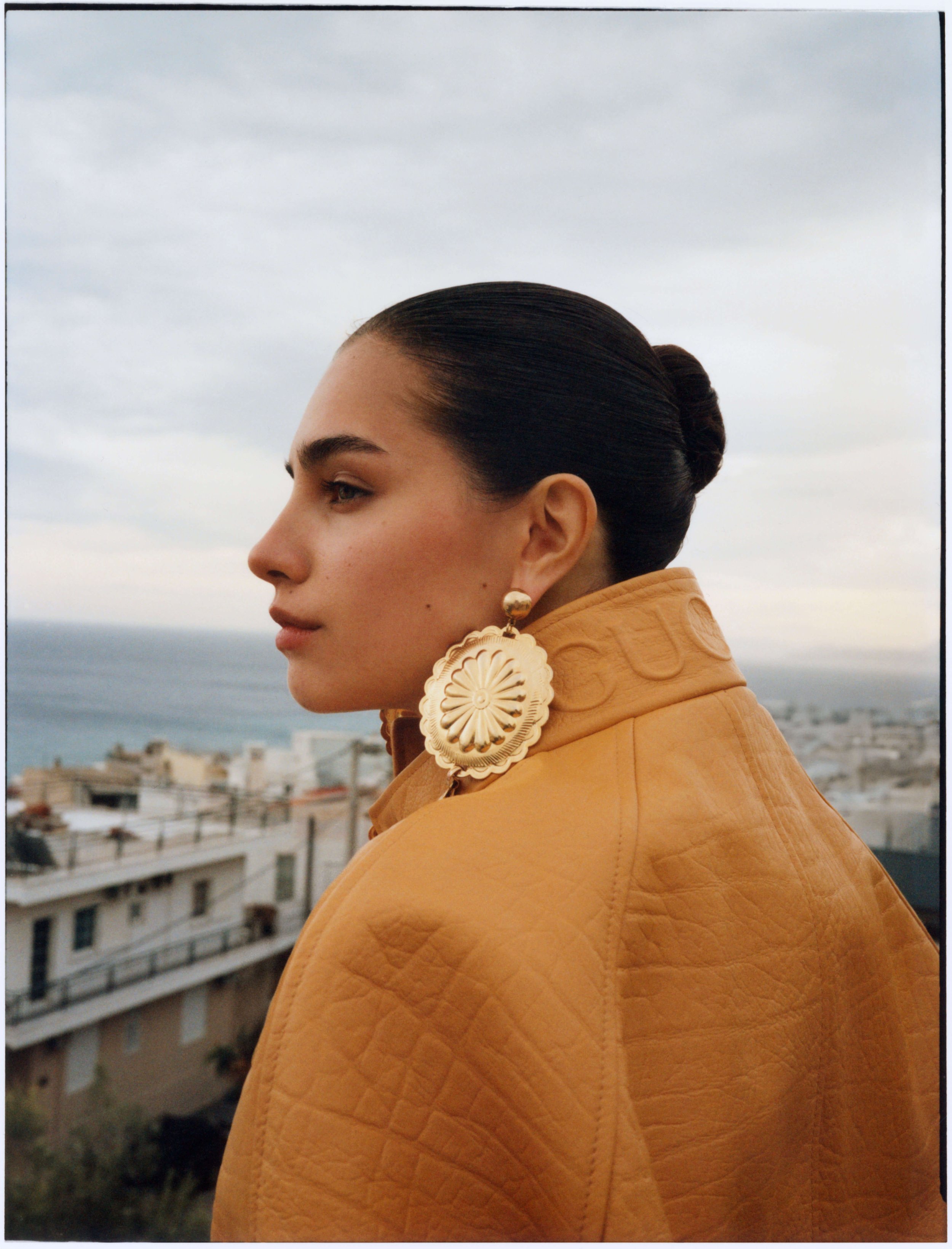 Close-up of model with bold earrings — Vogue editorial by FOS Production Greece