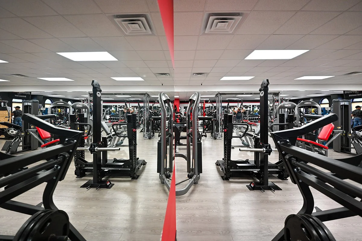 Rows of strength machines on the Bern Fit gym floor in New Bern, NC