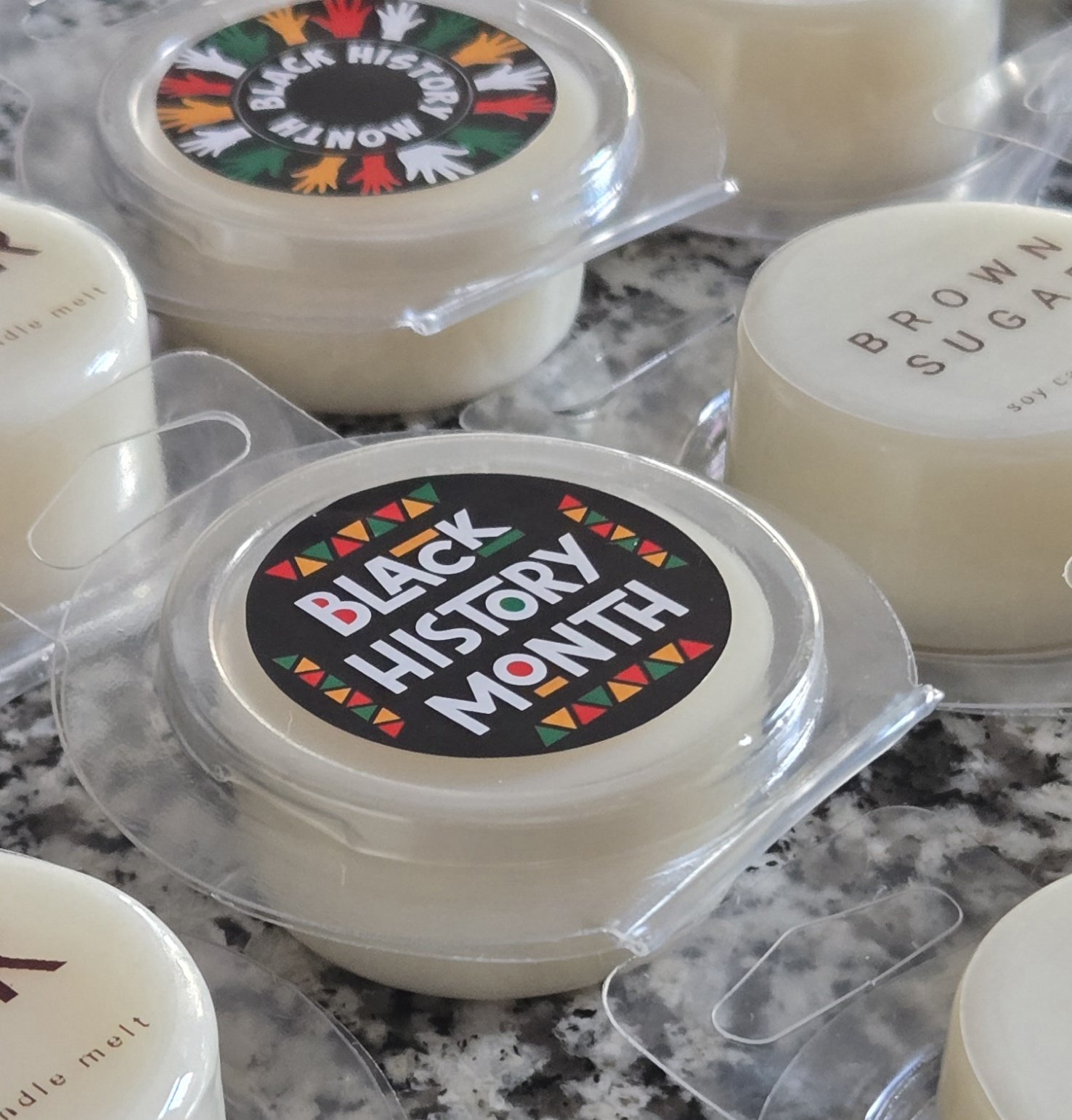 Custom-labeled wax melts for Black History Month celebrations.