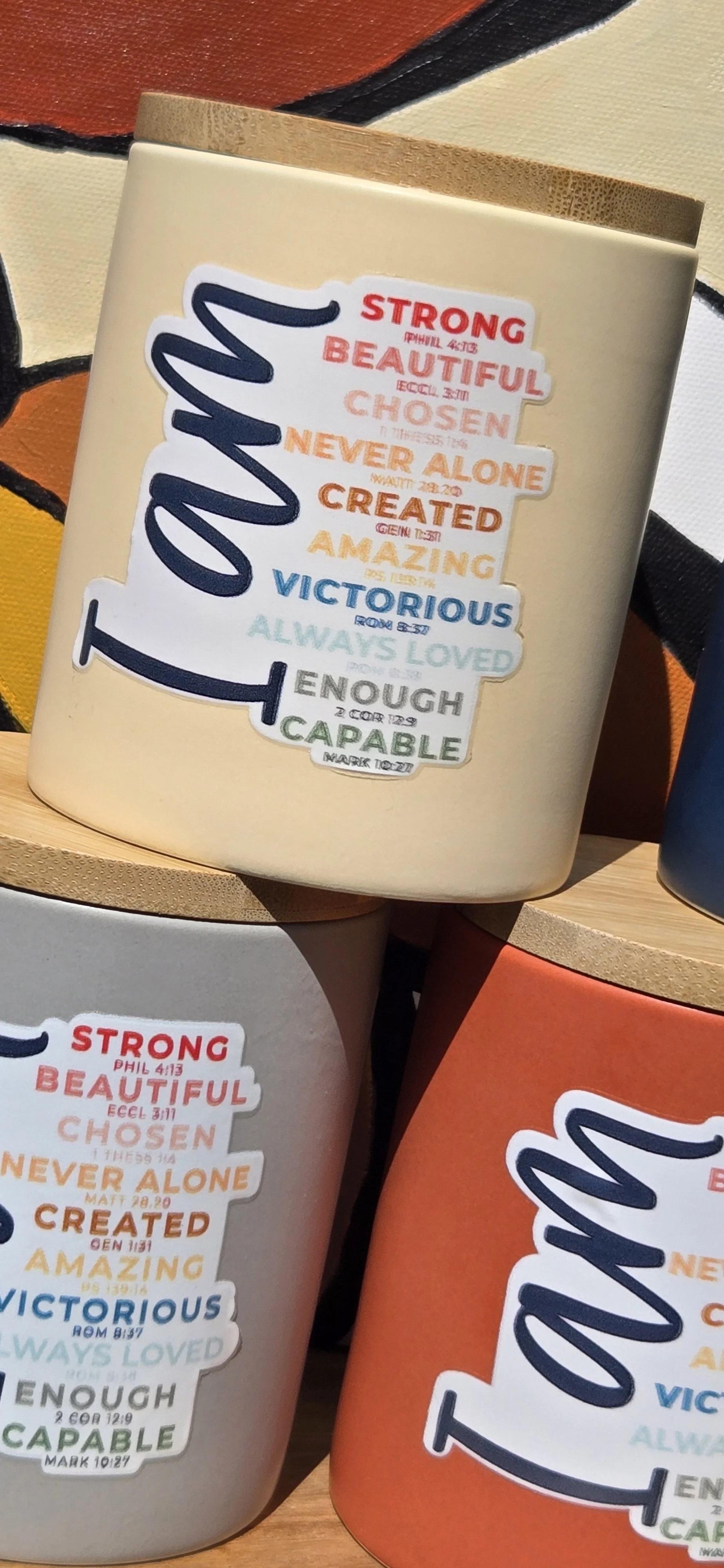 A closer look at an affirmation candle and personalized label.