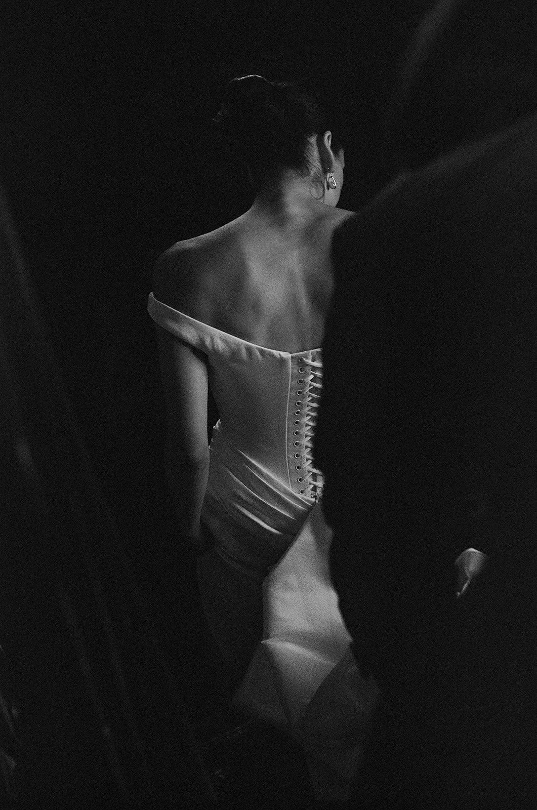 bride walking down a stairway where the light hits right