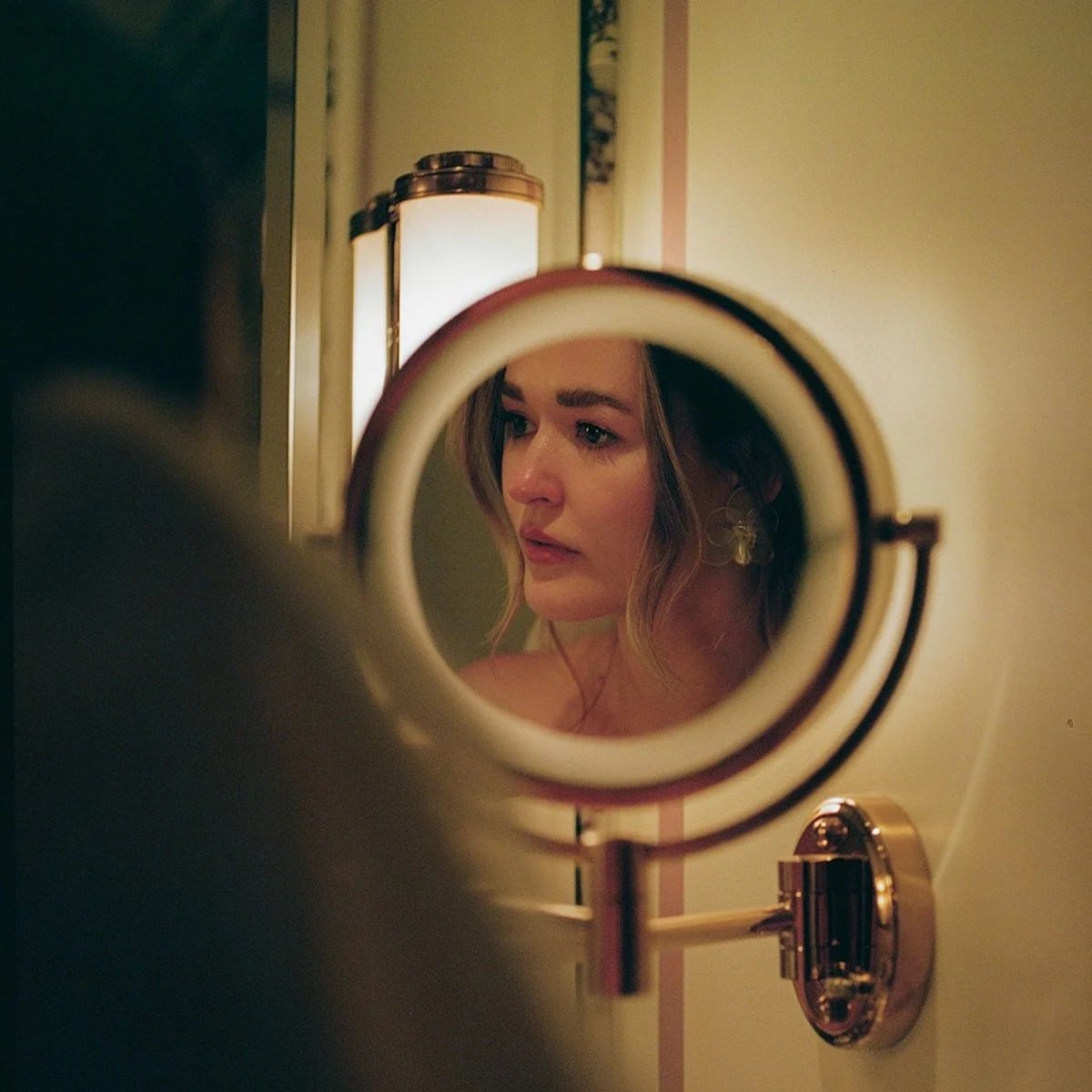woman in the mirror after crying