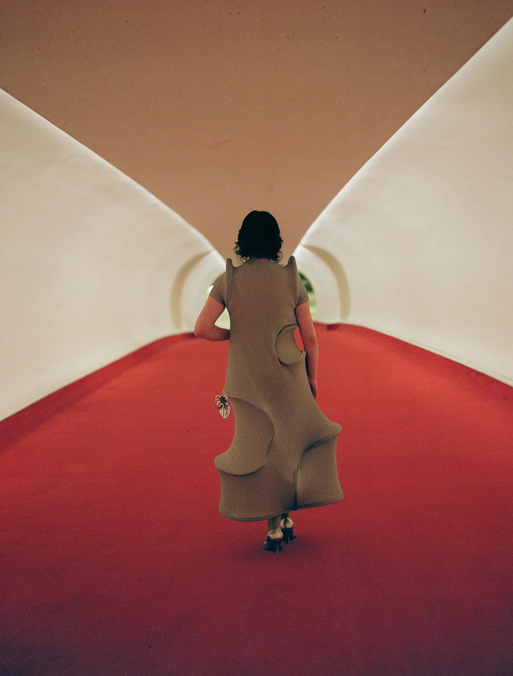 2025 chic bride in a melitta baumeister custom silver dress at the twa hotel in a red tunnel planned by mudari and shot by studiothao 