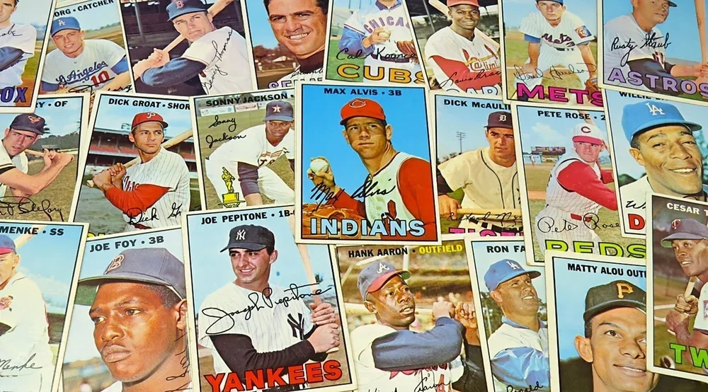 A collage of vintage baseball cards featuring various players from different teams, some with signatures.