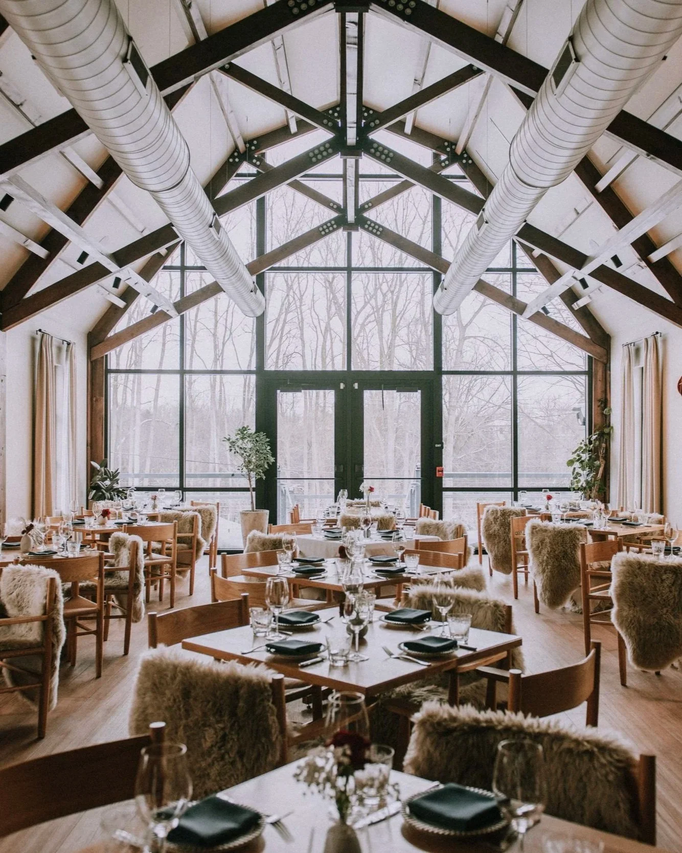 Vaulted historic barn dining room at Dixboro House near Ann Arbor