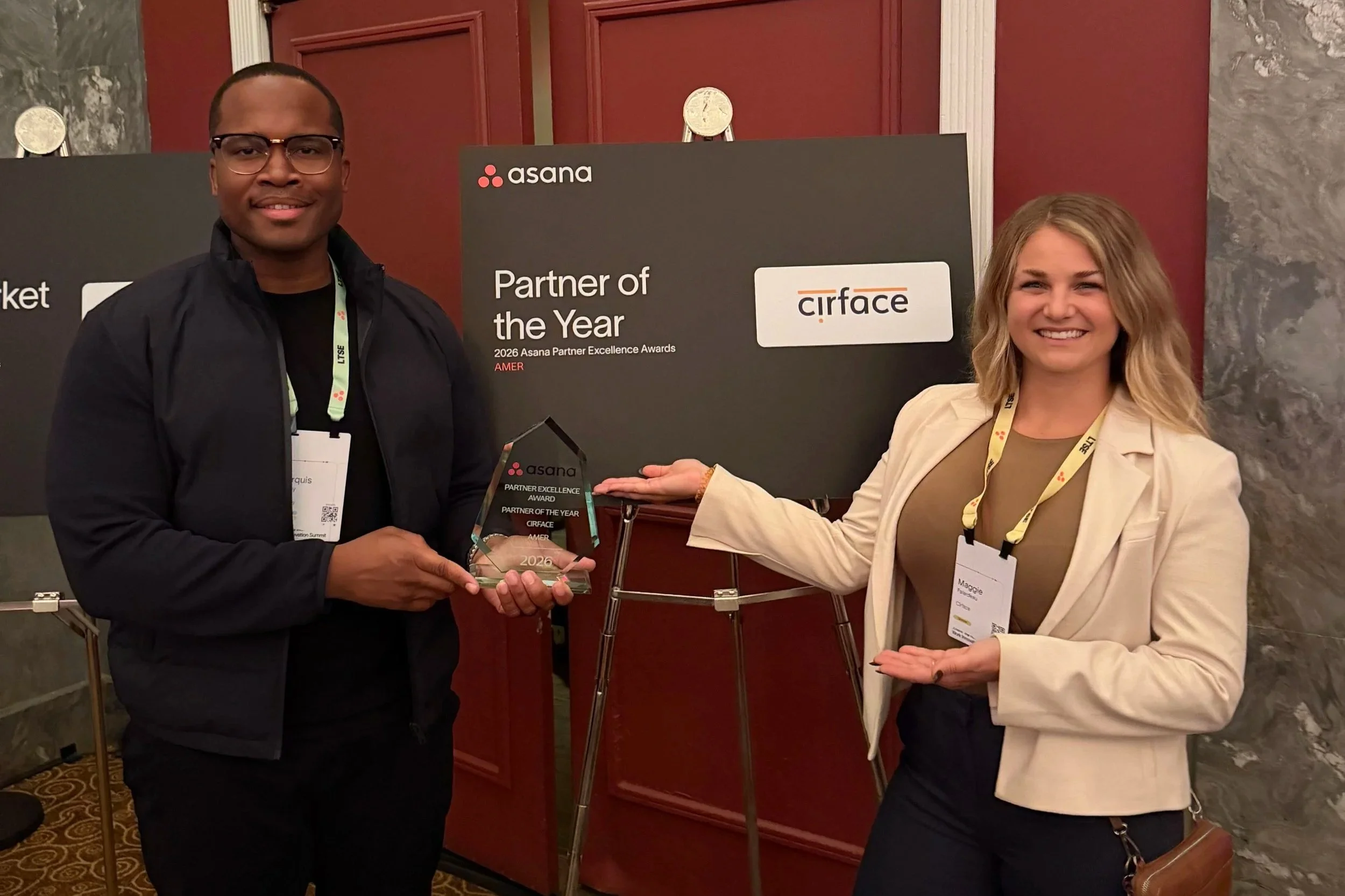 Marquis Murray, CEO and Founder of Cirface, and Maggie Falardeau, Head of Sales, with the 2026 Asana Partner of the Year award for the Americas at Asana’s Work Innovation Summit in New York City.