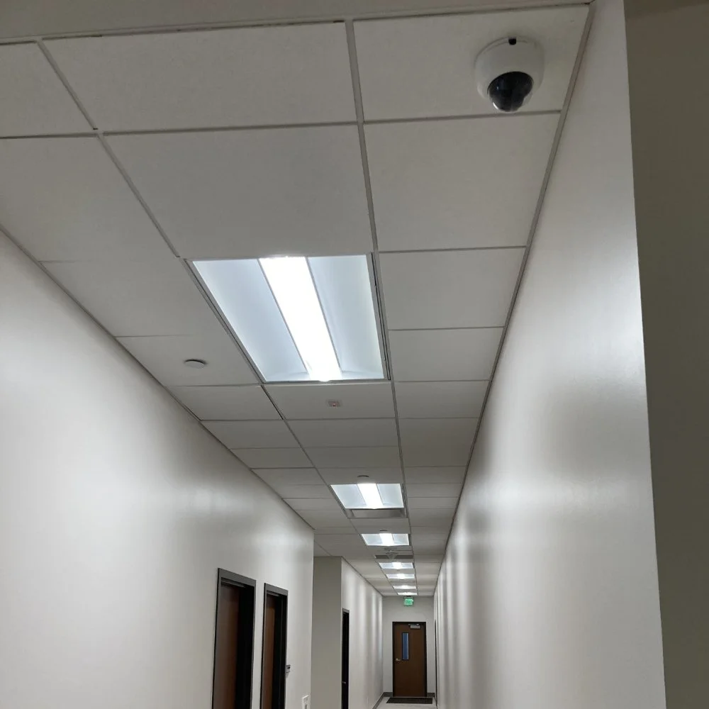 A security camera in an office hallway