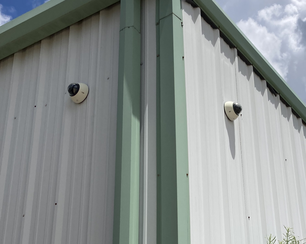 Security cameras installed on a warehouse exterior