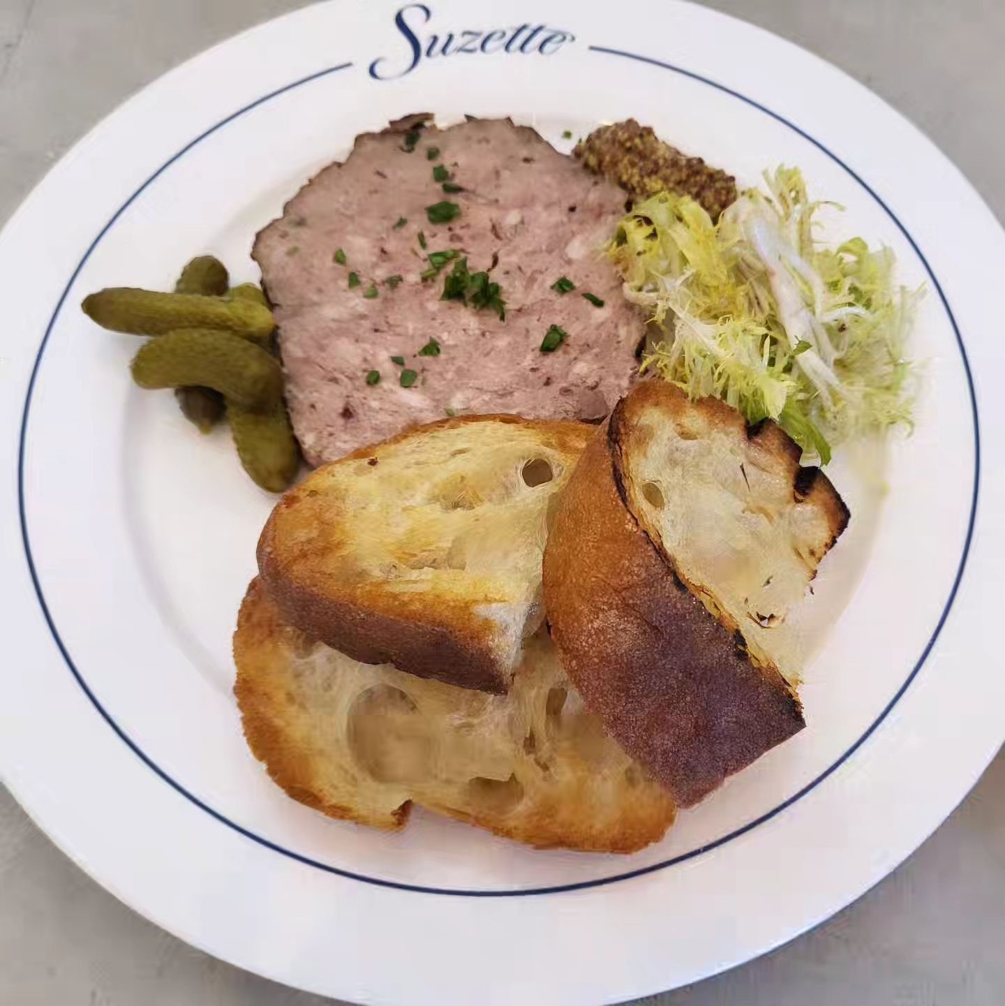 Have you tried our house-made P&acirc;t&eacute; de Campagne yet? 
It has quickly become a favorite at Suzette.