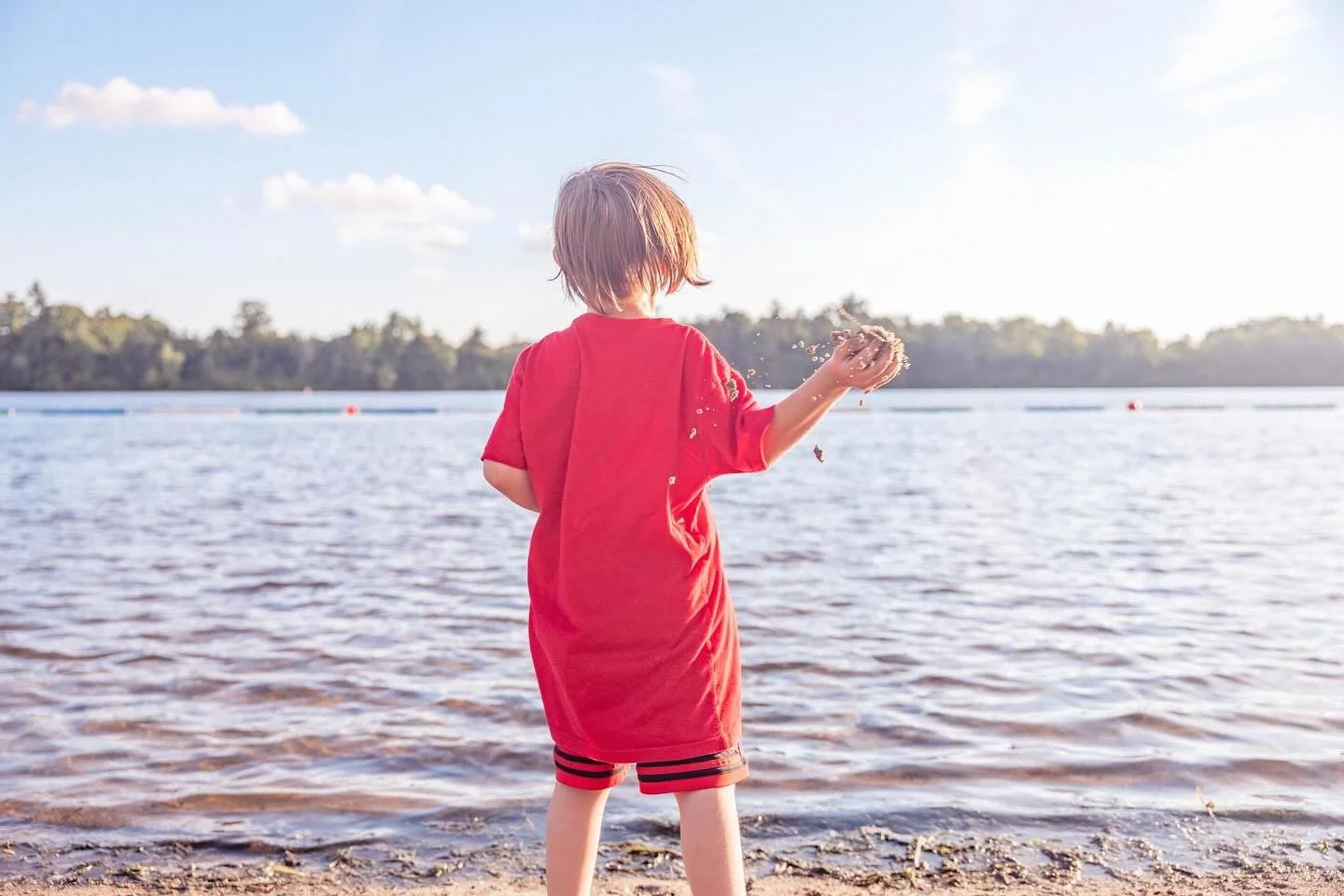 #throwback to summer vibes.

Capturing the pure joy and spontaneous energy of Ethan on Mooneys Bay reminds me why I love photographing moments like these. The way the natural light hits his hair, the perfect composition of sand, water, and sky&mdash;