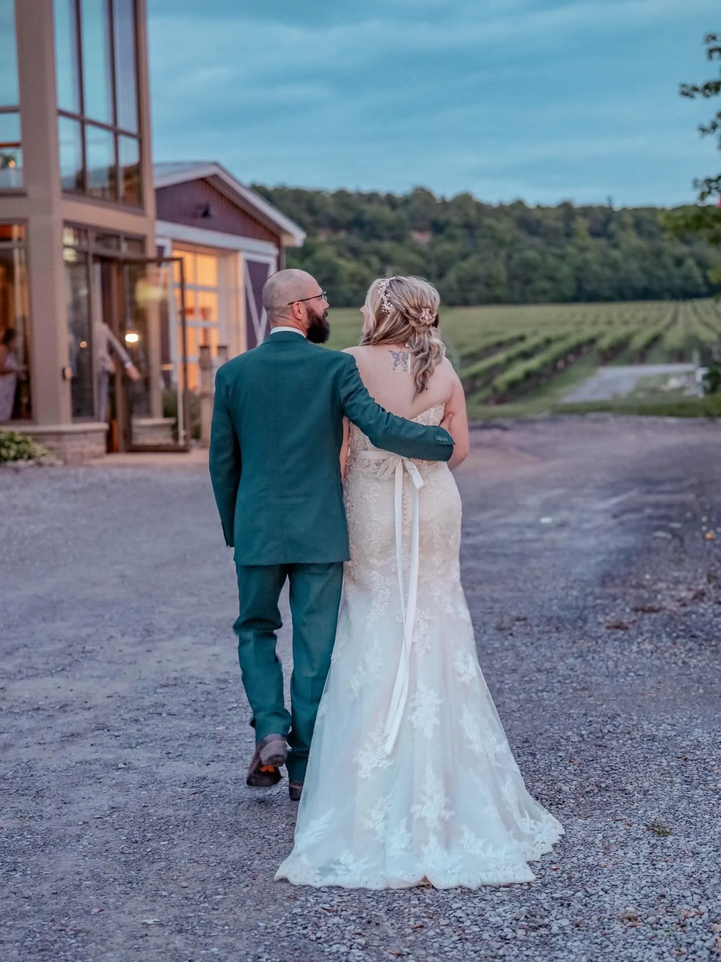 As they walk hand in hand back towards their celebration, you can feel the love and joy radiating from them. Leaving the sunset behind, they step into the glow of the evening, ready to rejoin their loved ones and start the next chapter together.

The