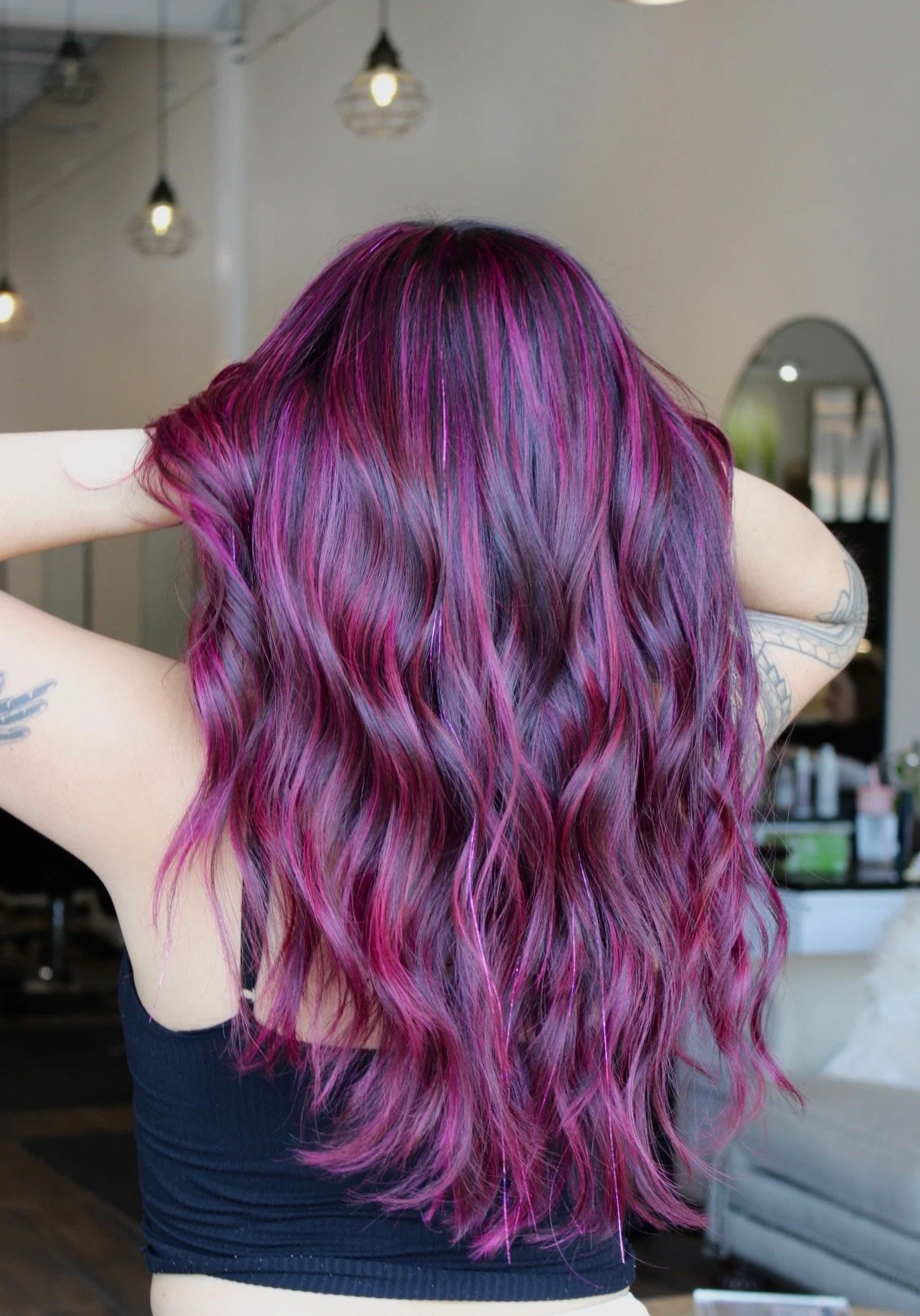 Vivid hair color service featuring bold magenta and purple tones, expert color correction, and custom fashion shades—perfect for vibrant, long-lasting salon results.