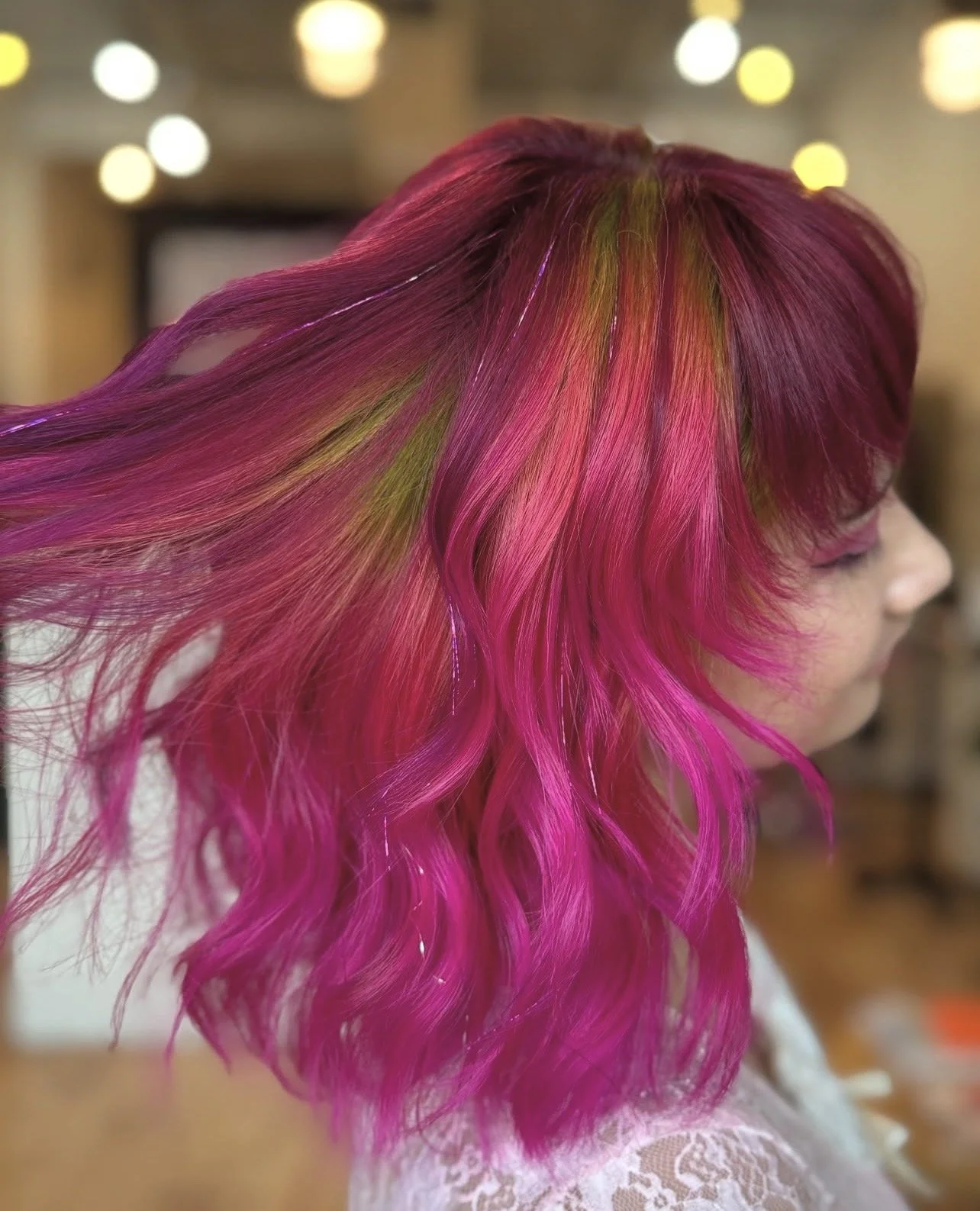 This customized color service includes fashion shades such as reds, coppers, blues, pinks, and creative multi-dimensional tones, tailored to your desired look and hair type.