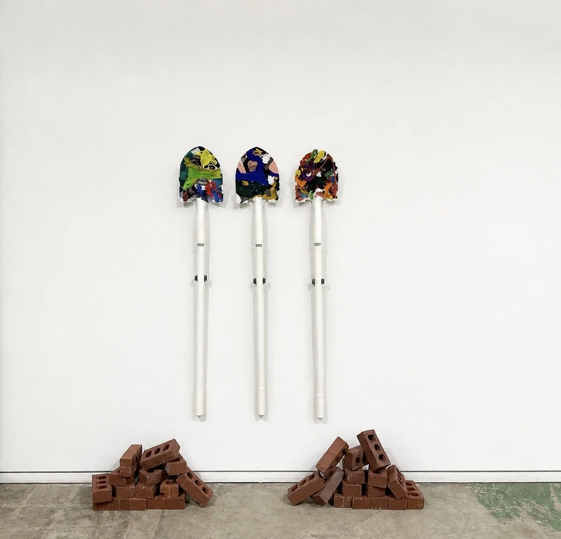 These sculptural shovels examine the weight we carry through land, labor, lineage, and legacy. A tool made to break ground, dig beneath the surface, and tend what grows, the shovel becomes a reflection of the exhibition’s central duality: we are shap