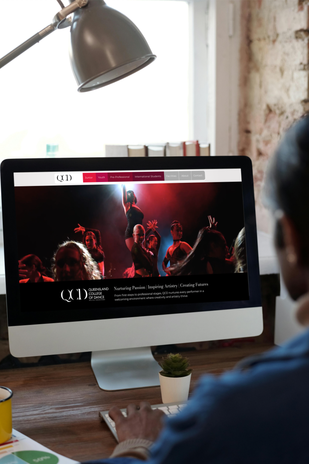 QLD College of Dance website displayed on a desktop computer